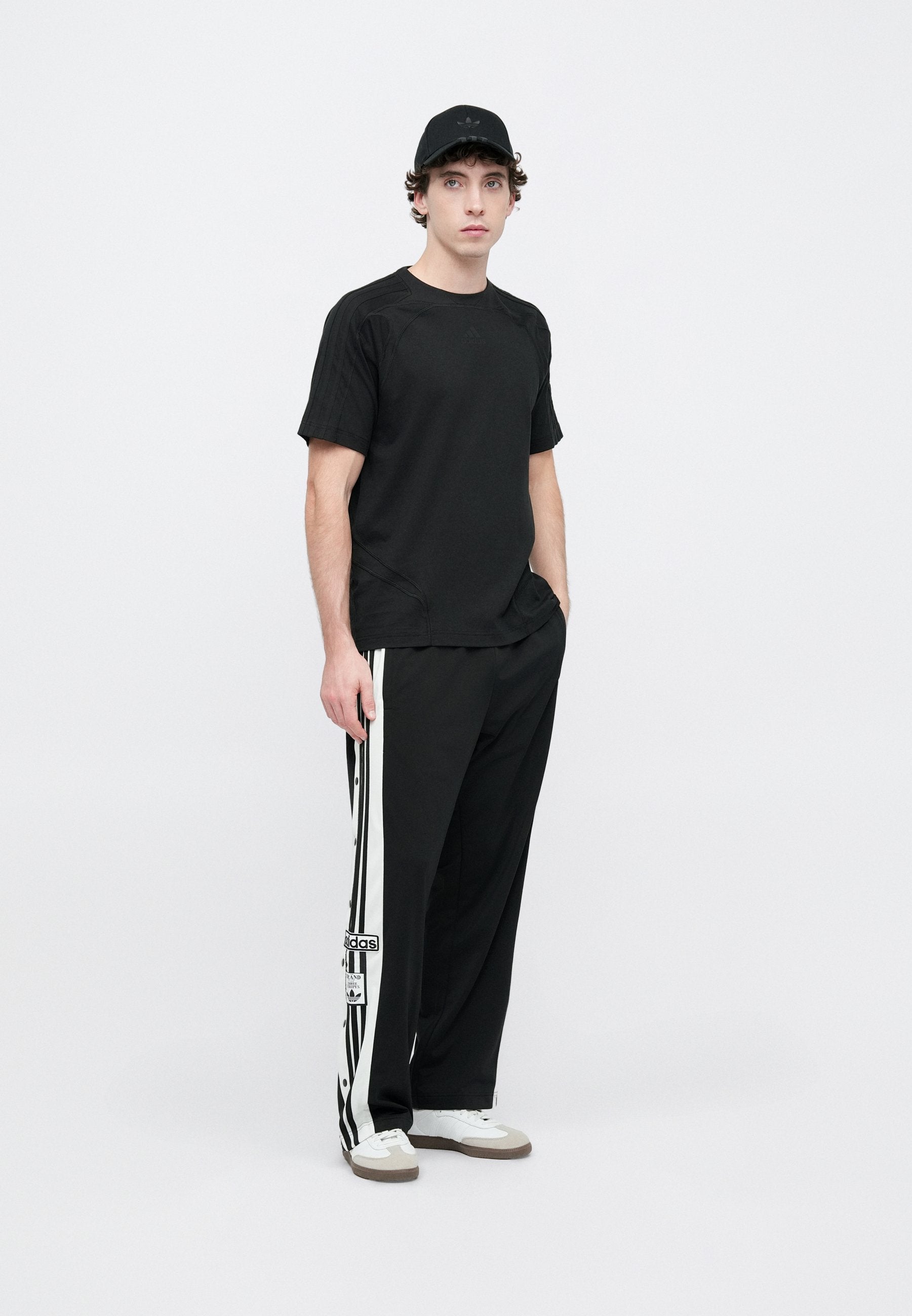 ADIBREAK UNISEX - Tracksuit bottoms - black/white