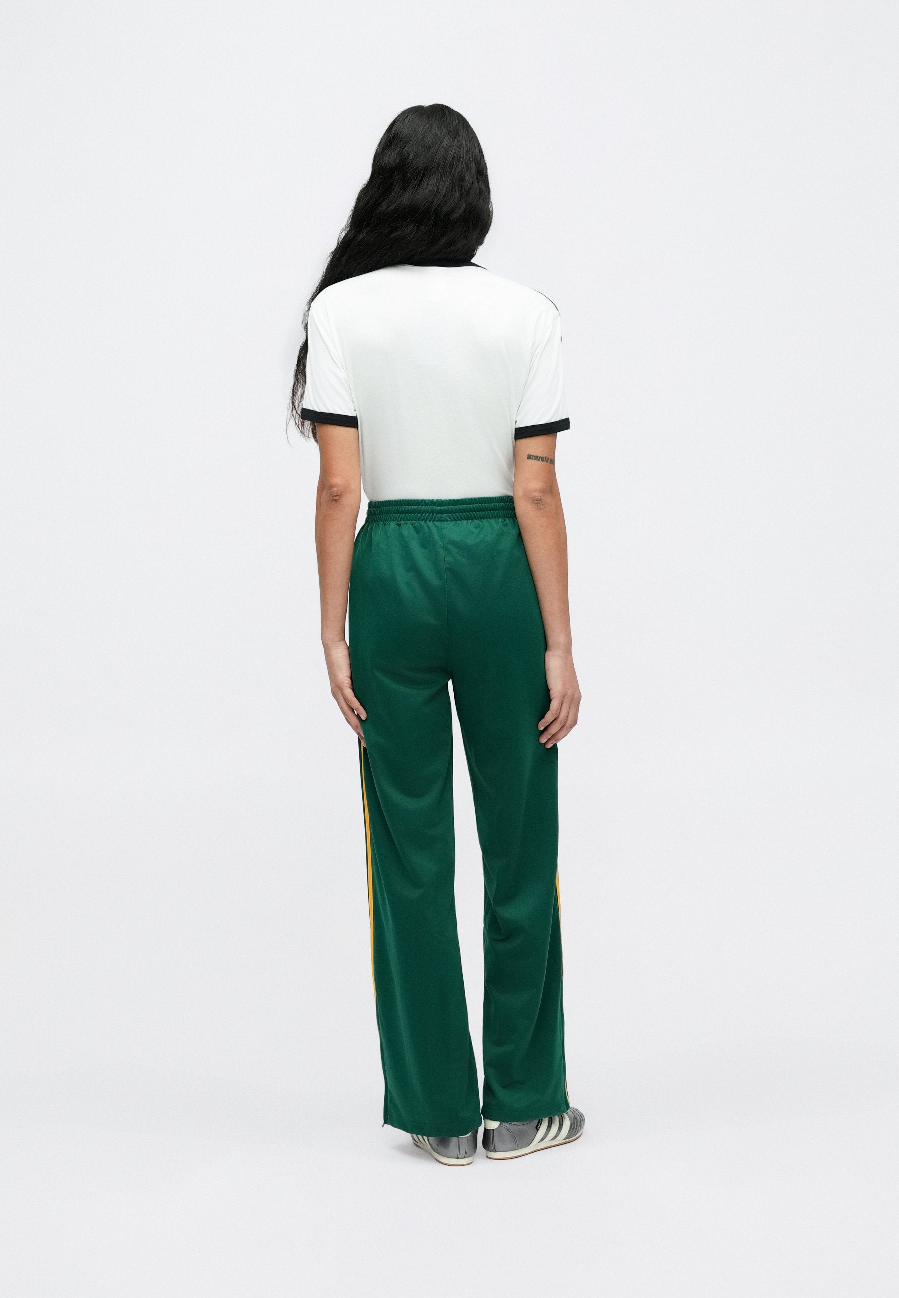 FIREBIRD LOOSE TRACKSUIT PANTS - Tracksuit bottoms - collegiate green/crew yellow
