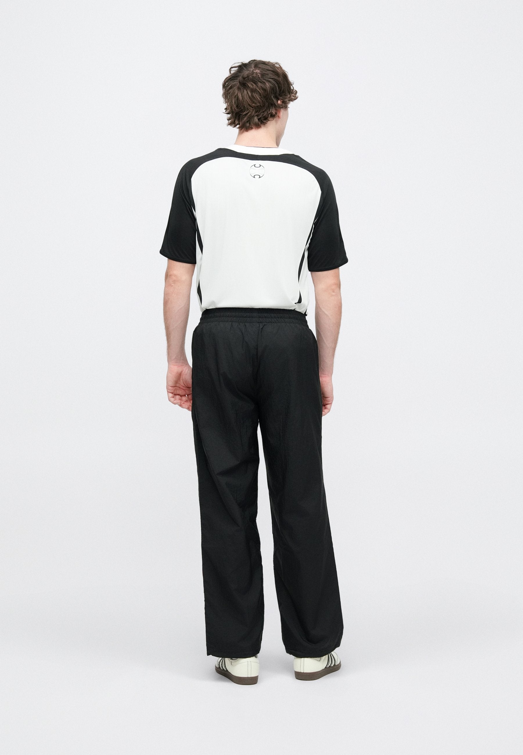ARCH TRACK PANT UNISEX - Tracksuit bottoms - black/better scarlet