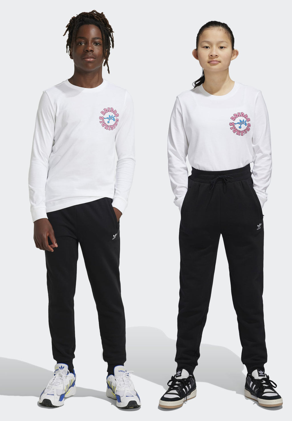 JUNIOR  - Tracksuit bottoms - black