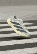 ADIZERO EVO SL EXO W - Road running shoes - cloud white/grey four/silver-coloured