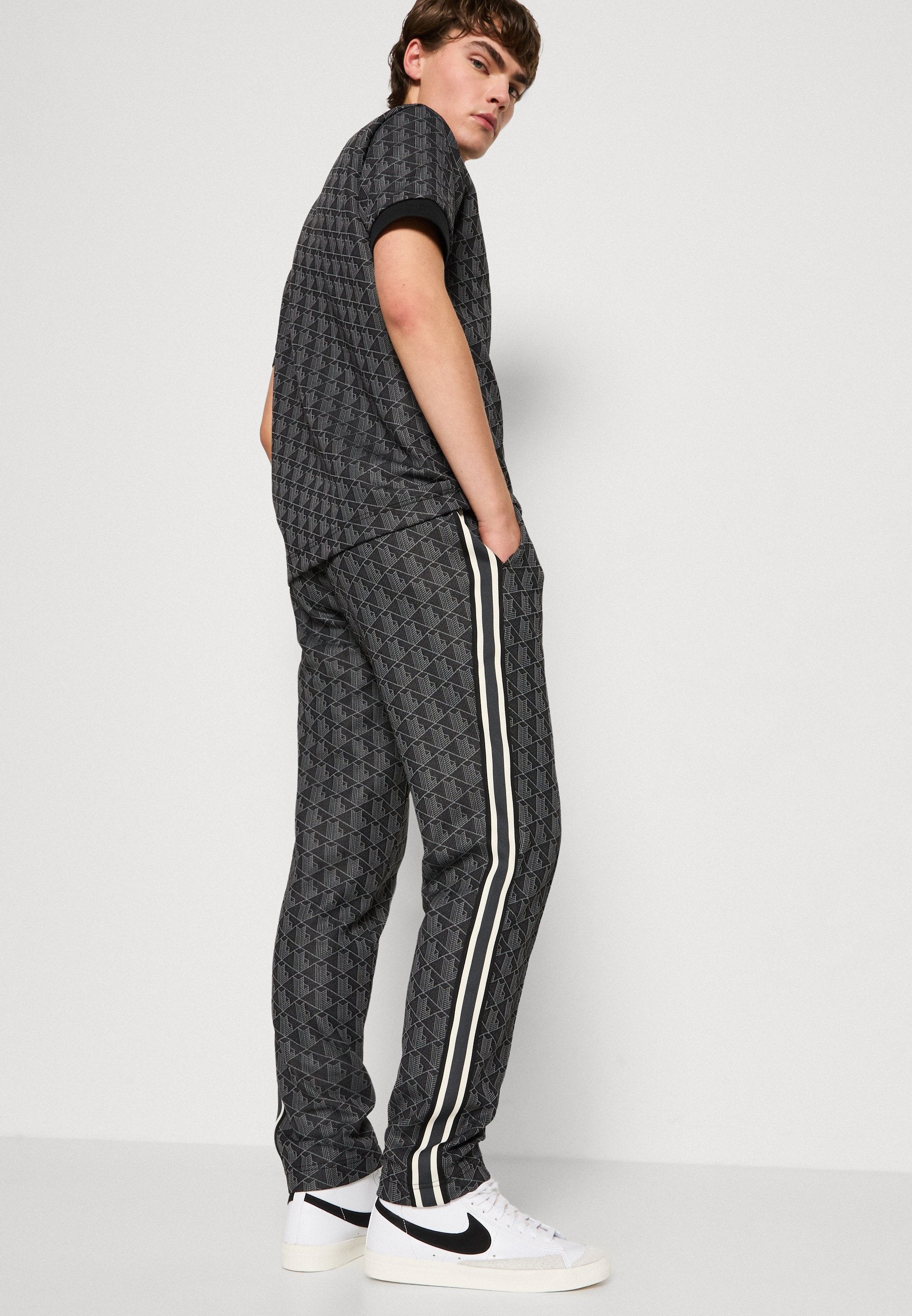 UNISEX - Tracksuit bottoms - black/graphite