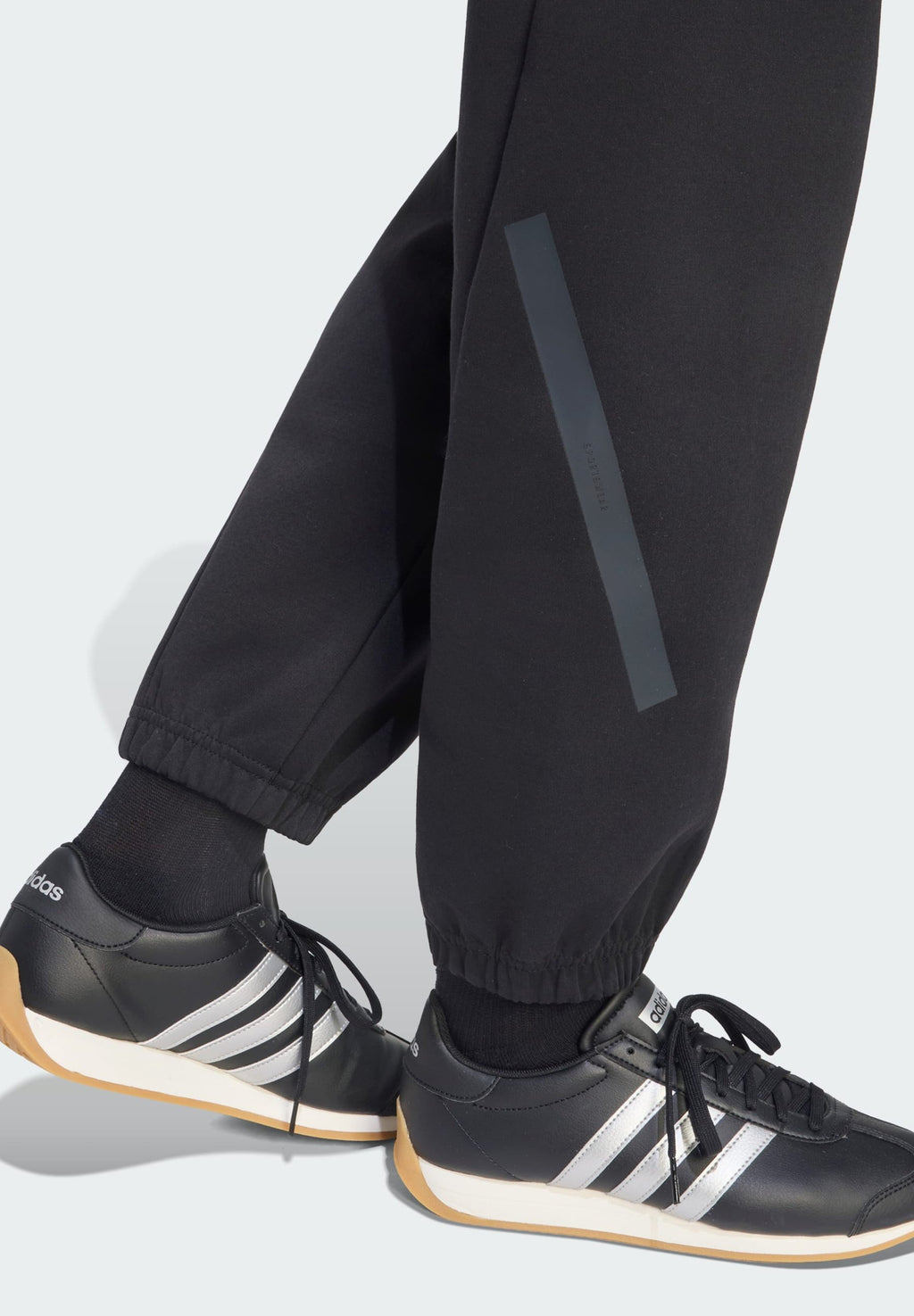 ADIDAS Z.N.E. PANTS - Tracksuit bottoms - black