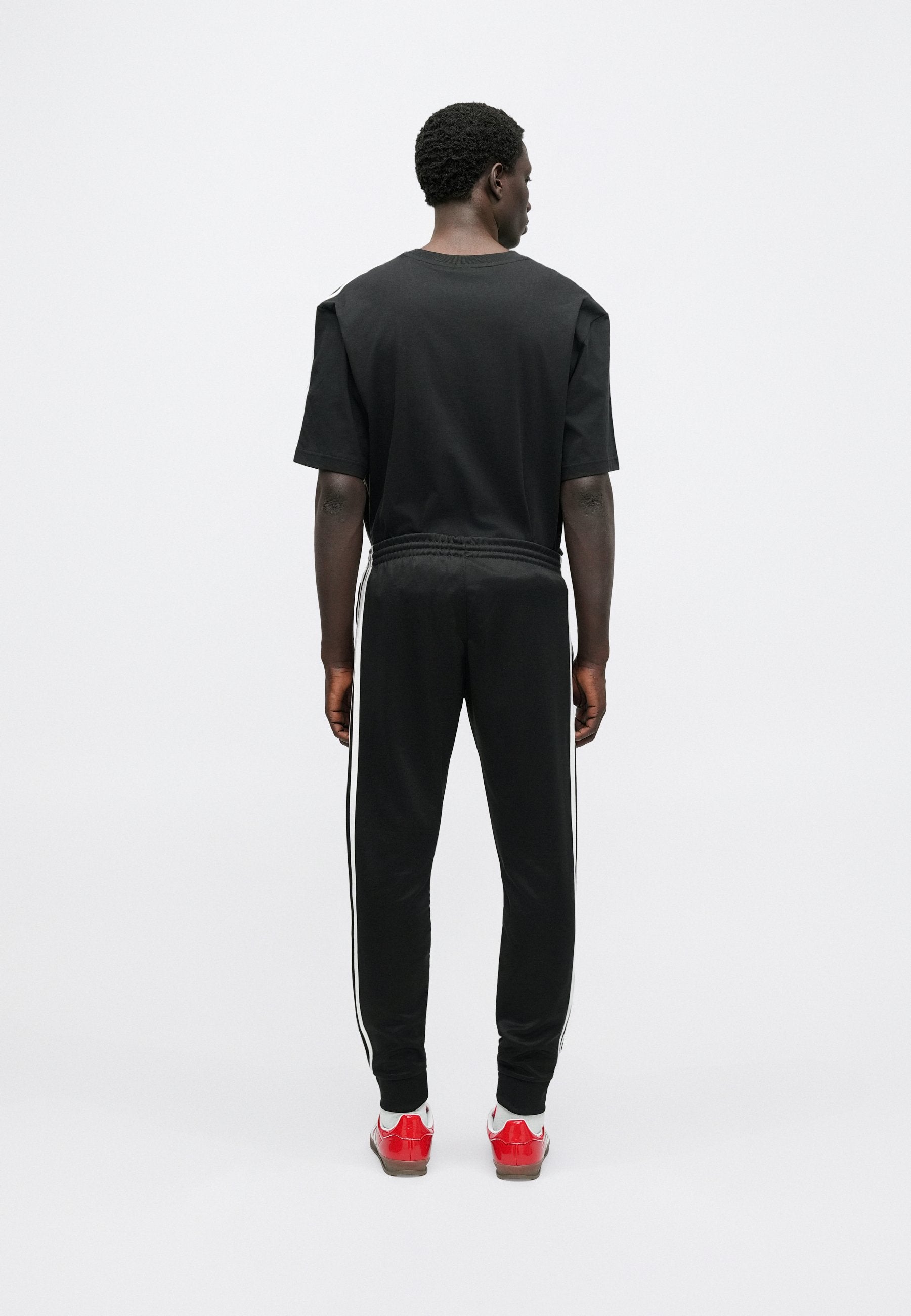 SST TP - Tracksuit bottoms - black