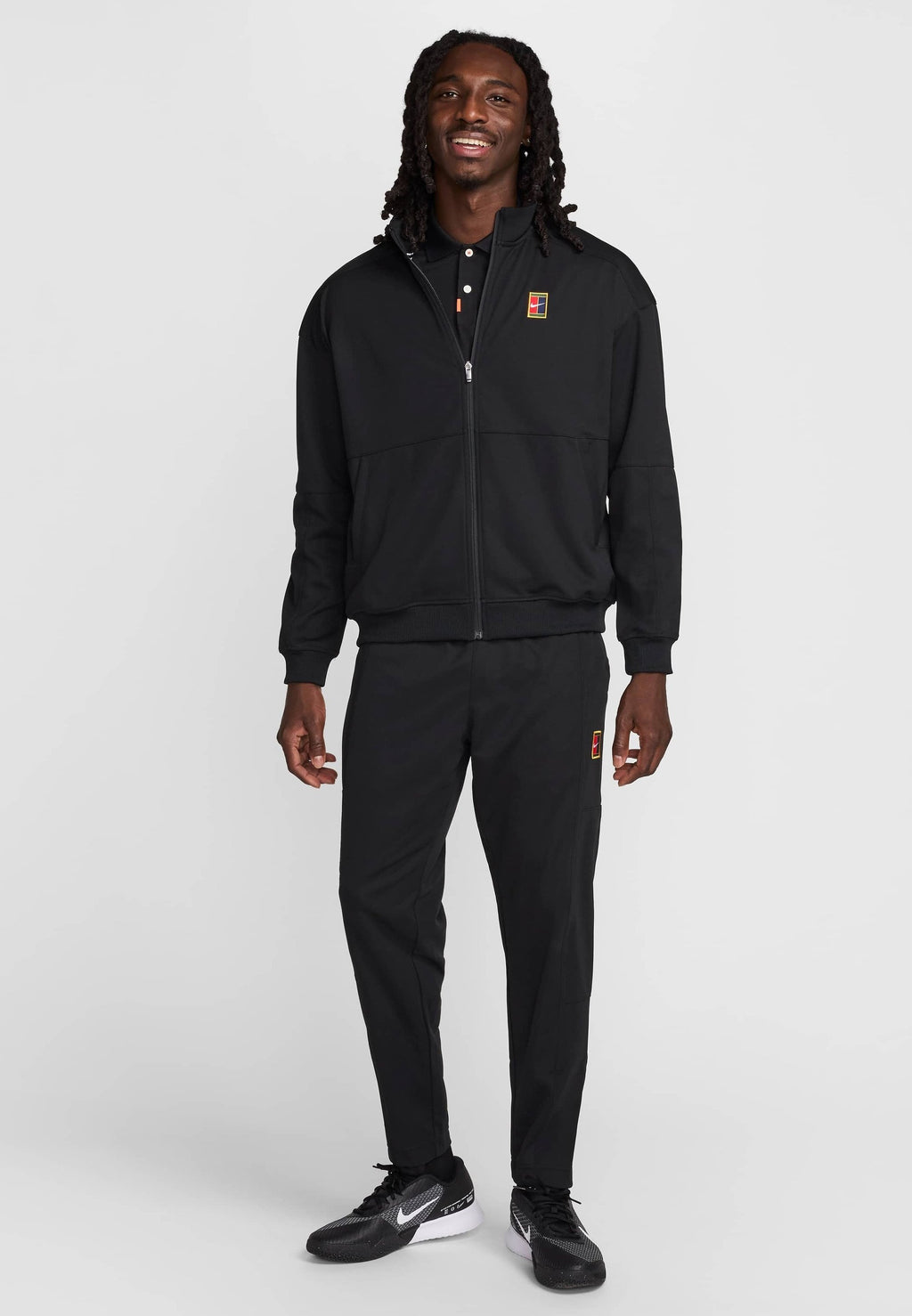 HERITAGE - Tracksuit bottoms - black black