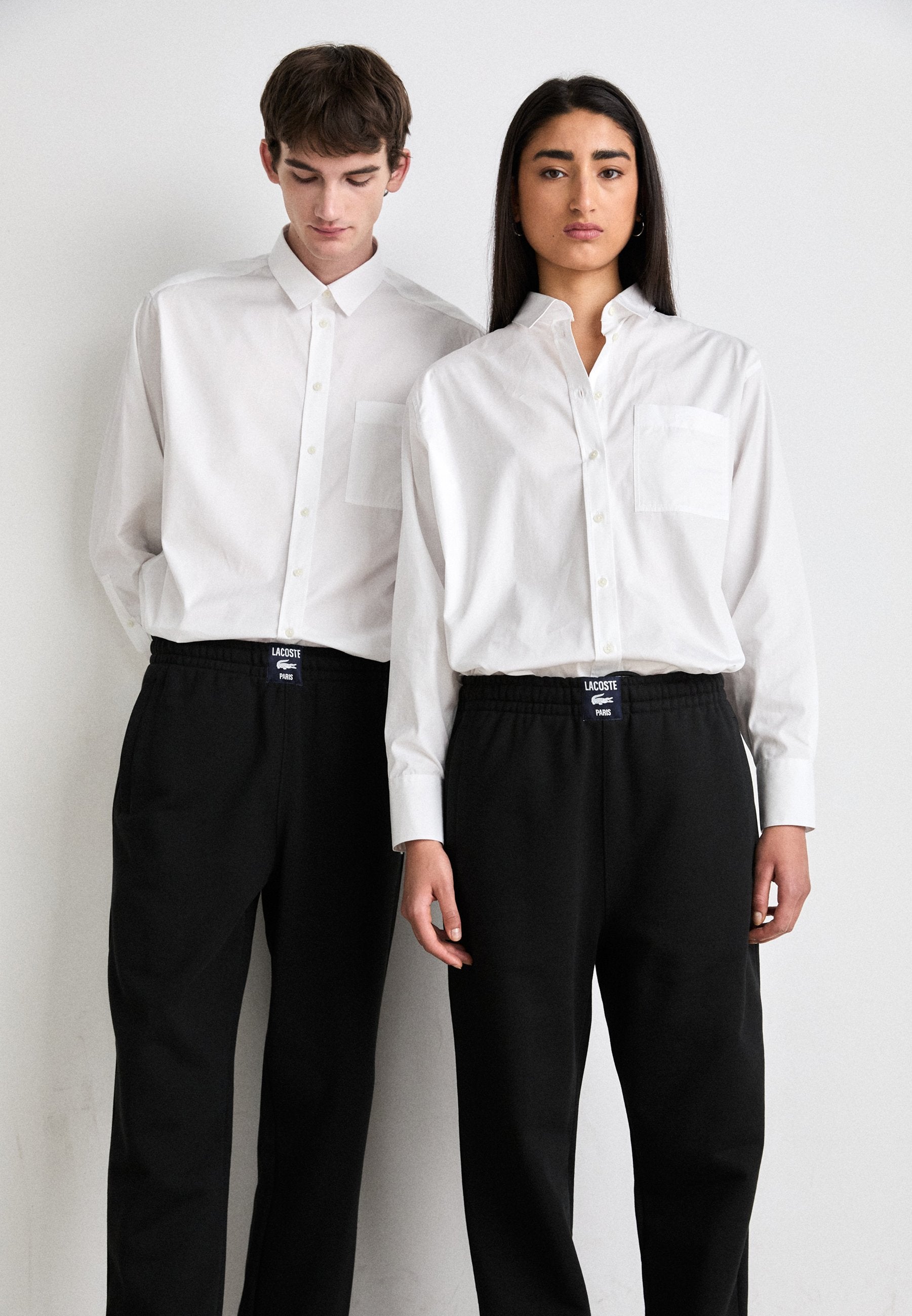UNISEX - Tracksuit bottoms - black
