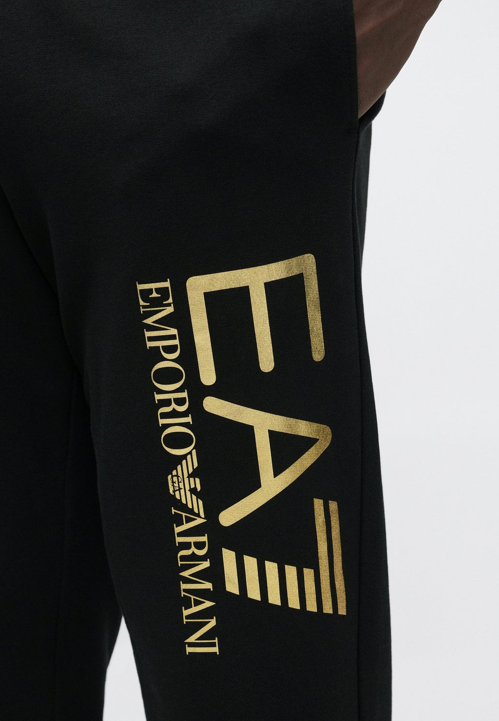 TRAIN CORE BIG LOGO PANTS - Tracksuit bottoms - black/gold-coloured