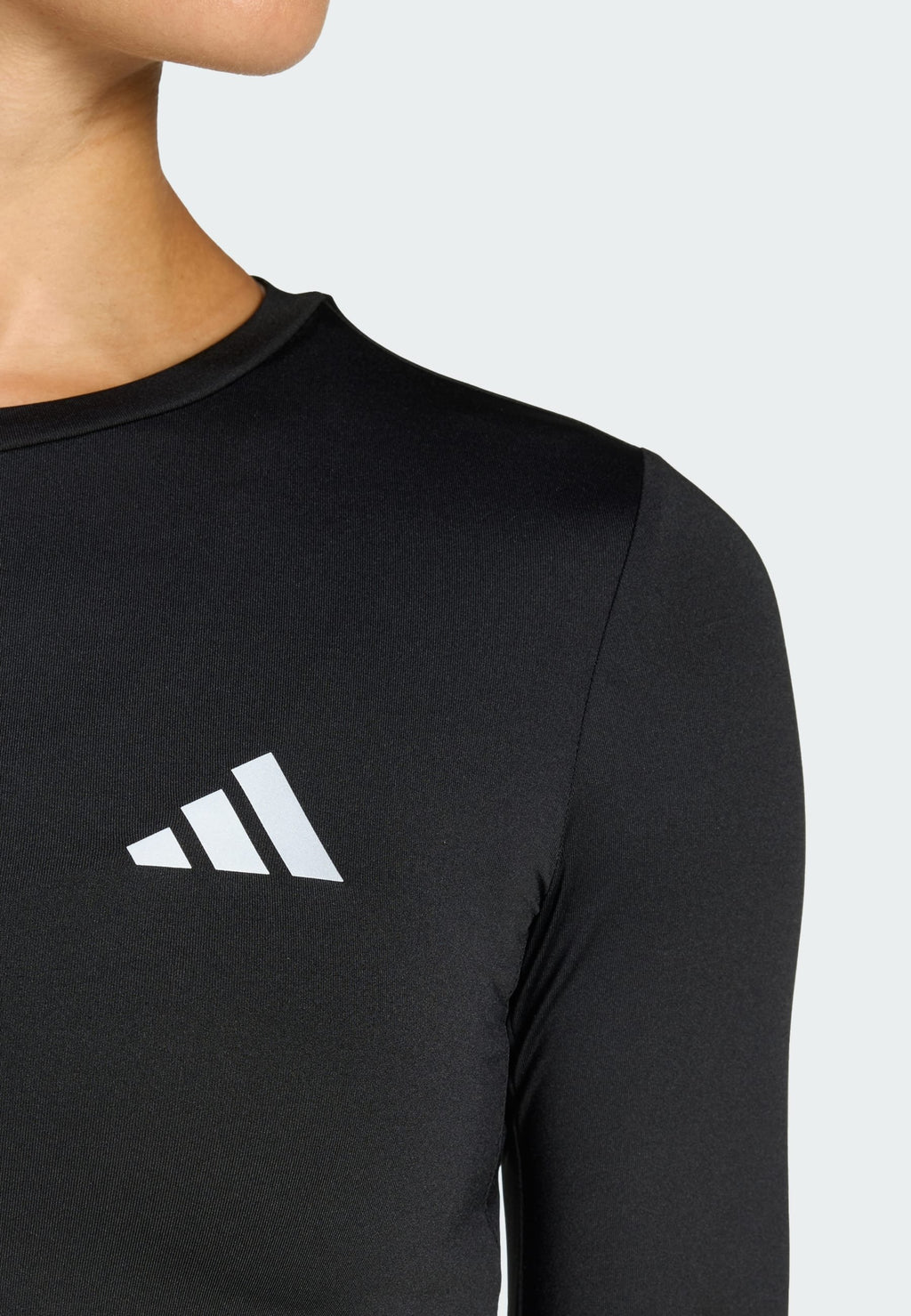 RUN ESS LS W - Uzun kollu üst - siyah