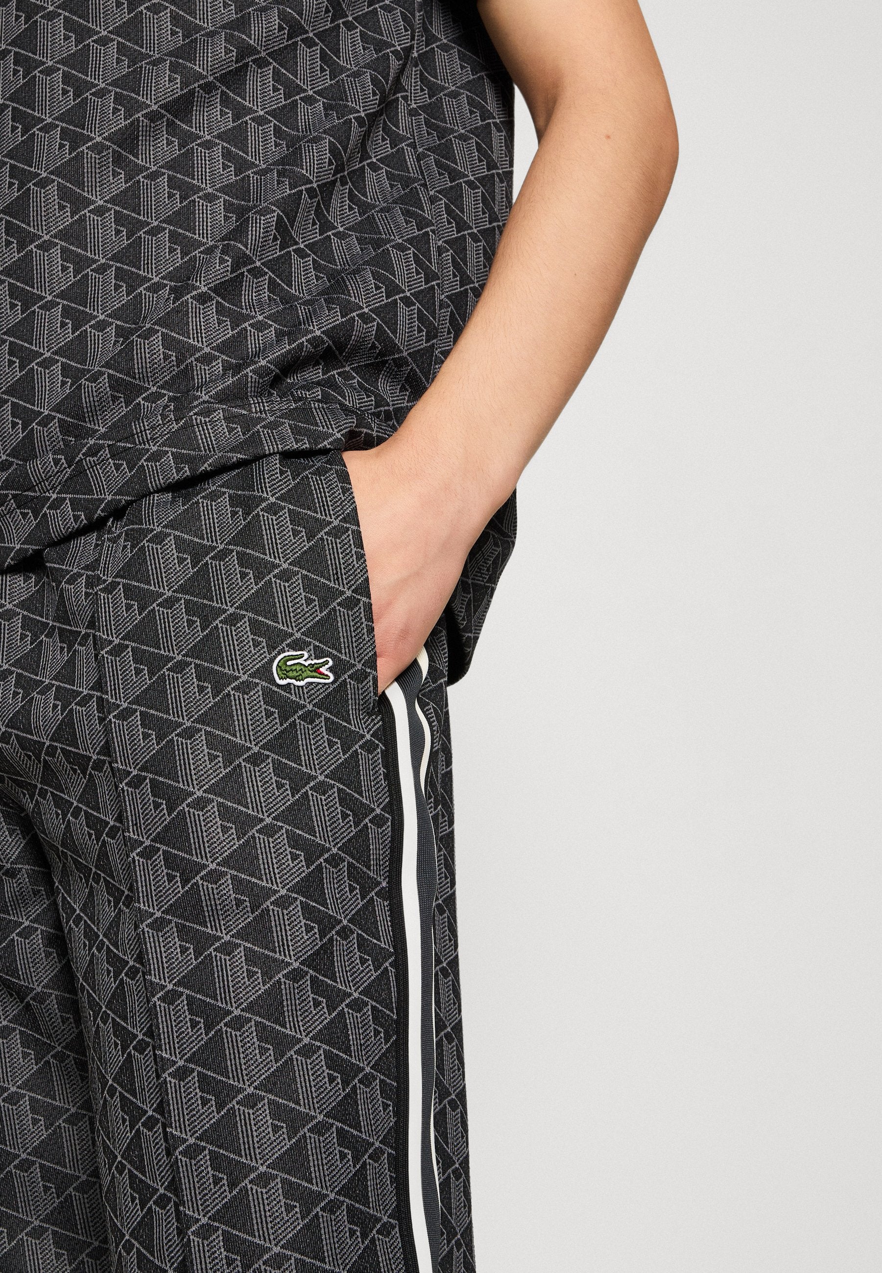 UNISEX - Tracksuit bottoms - black/graphite