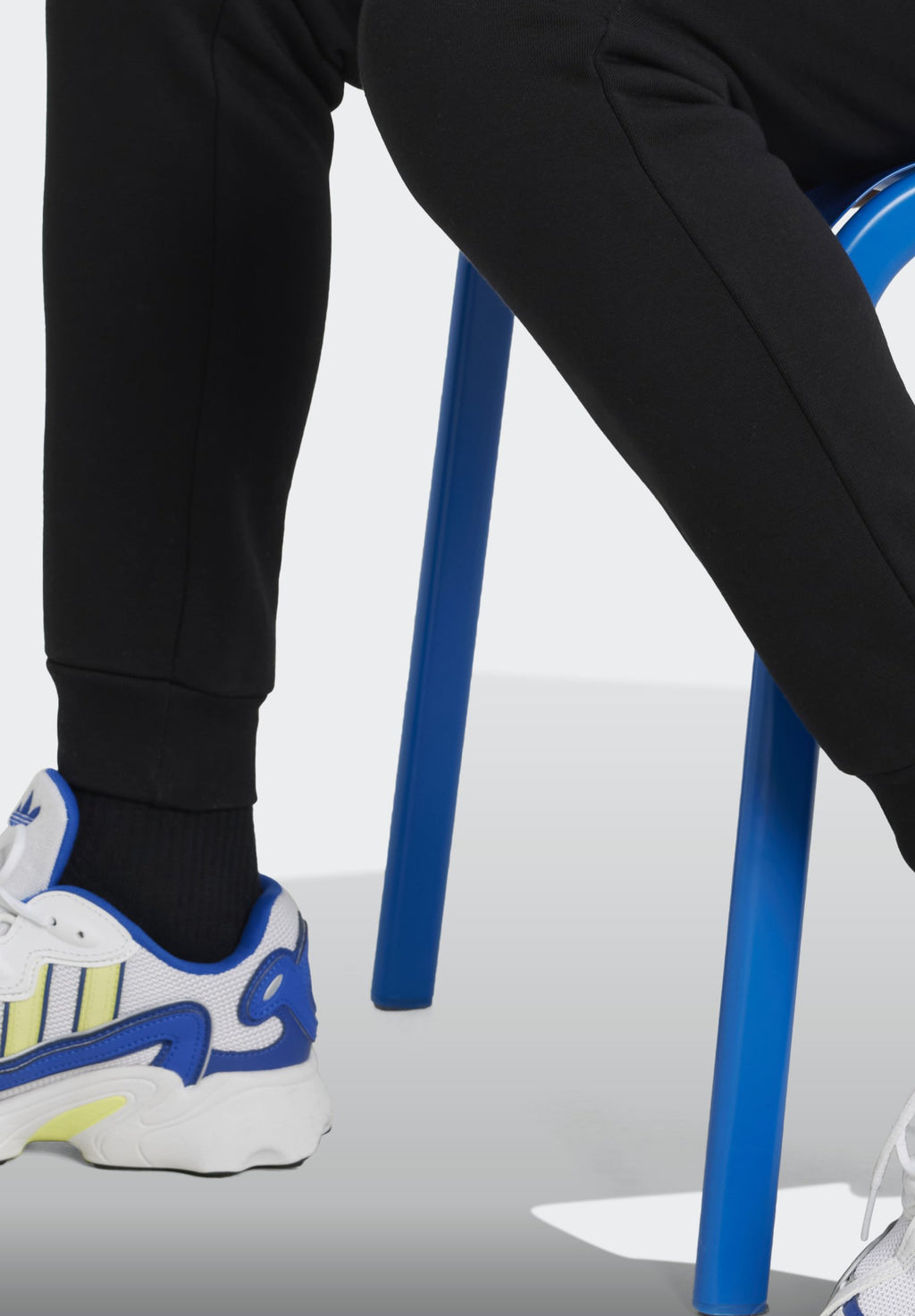 JUNIOR  - Tracksuit bottoms - black