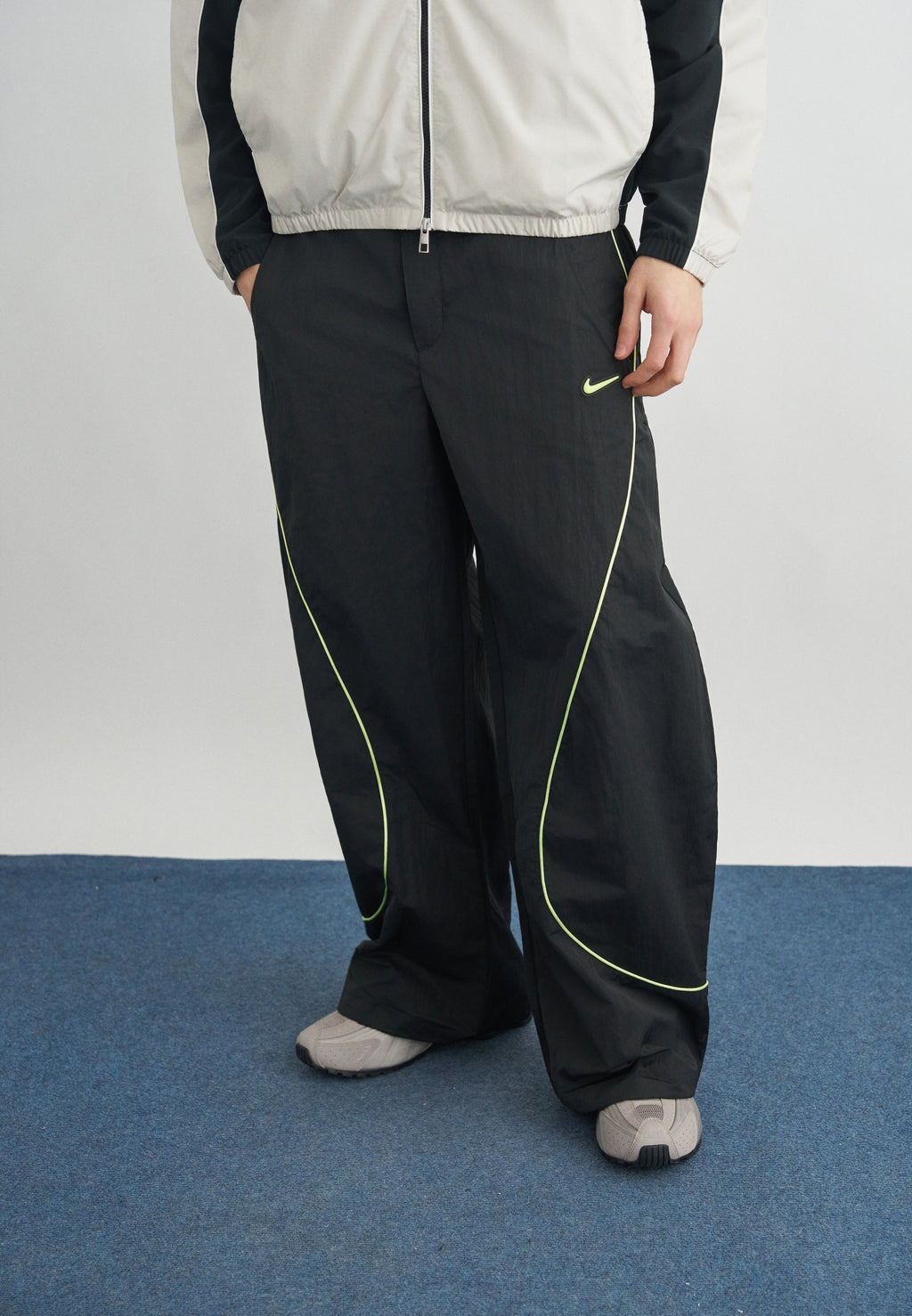 TOBI - Tracksuit bottoms - black/volt ice/cream