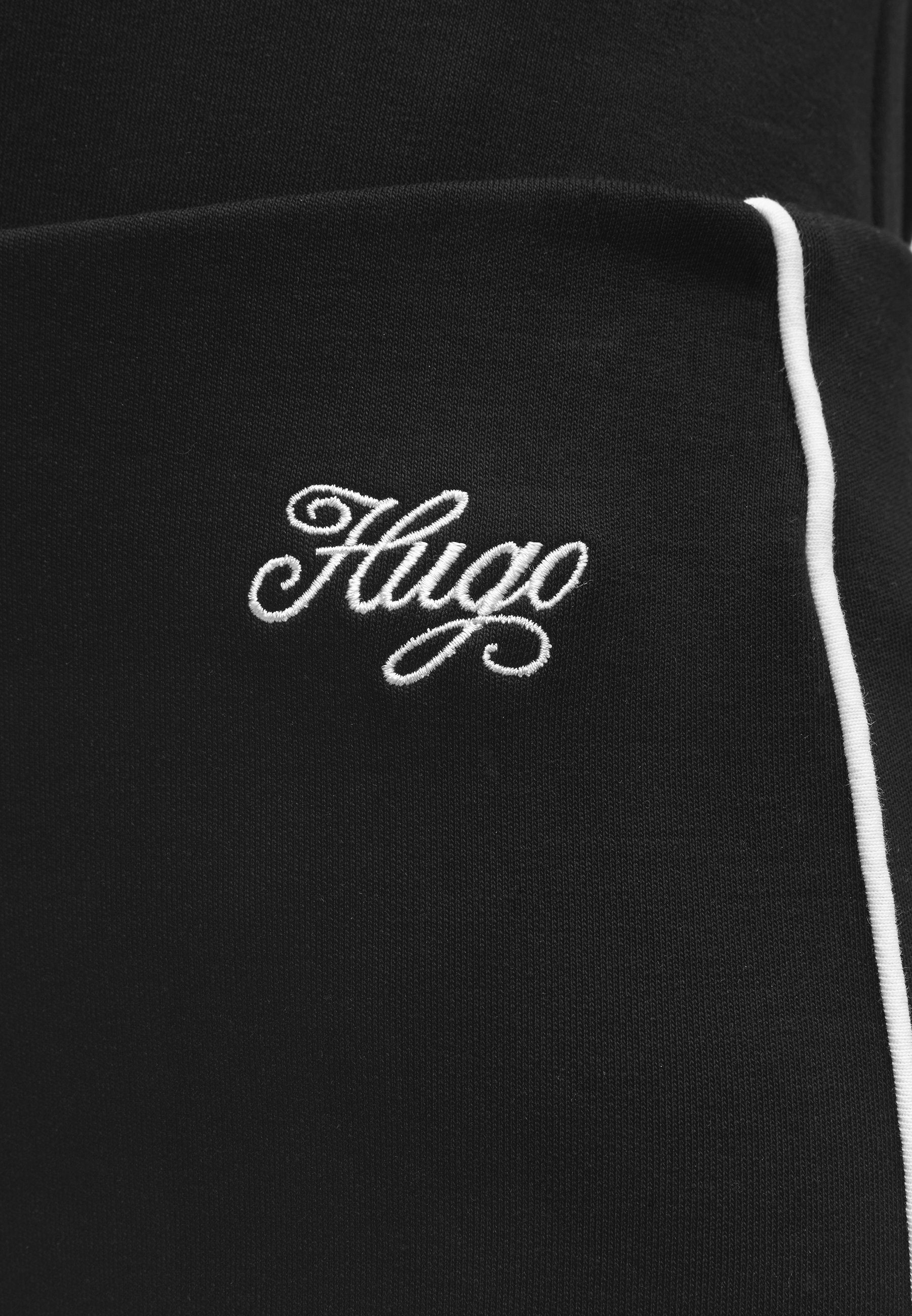 NIFLACK - Trousers - black