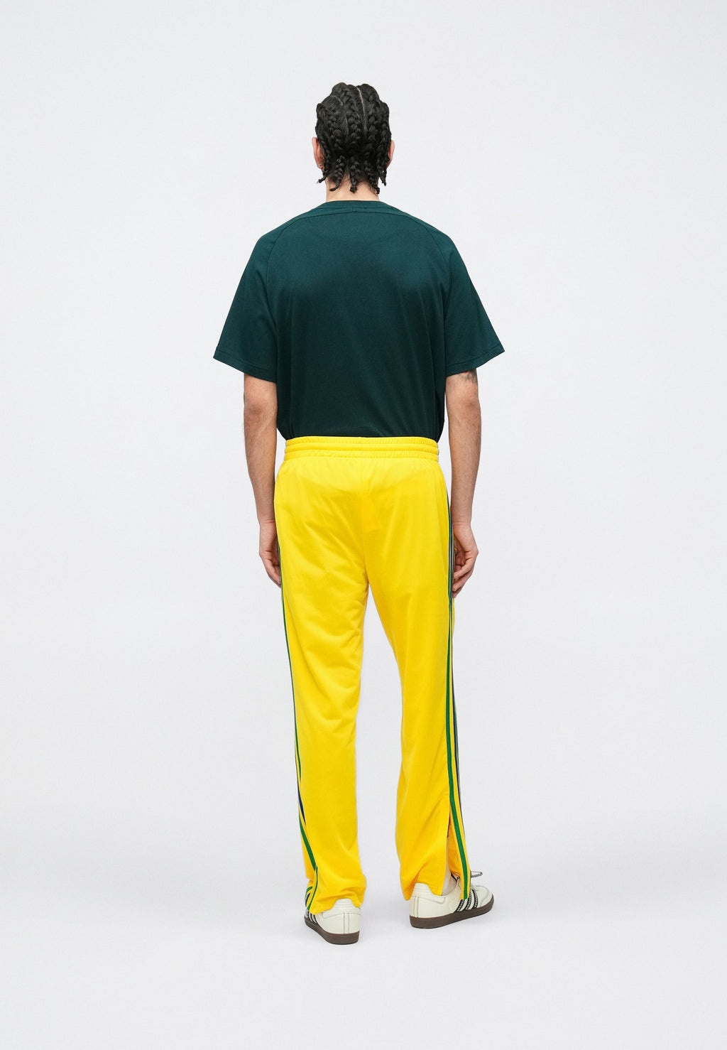 FIREBIRD TP - Tracksuit bottoms - yellow