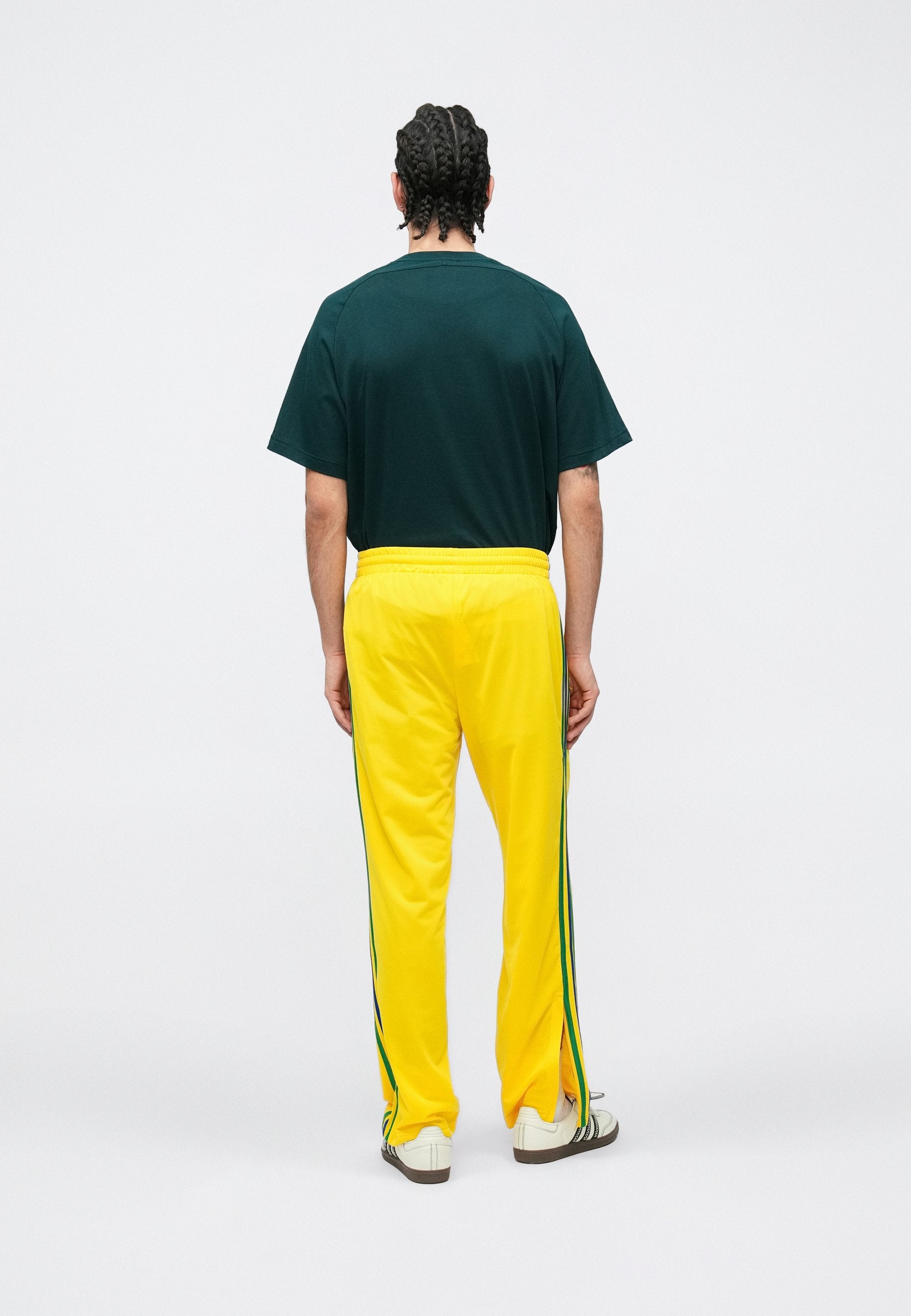 FIREBIRD TP - Tracksuit bottoms - yellow