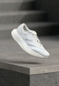 ADIZERO EVO SL W - Trainers - footwear white/warm sandstone