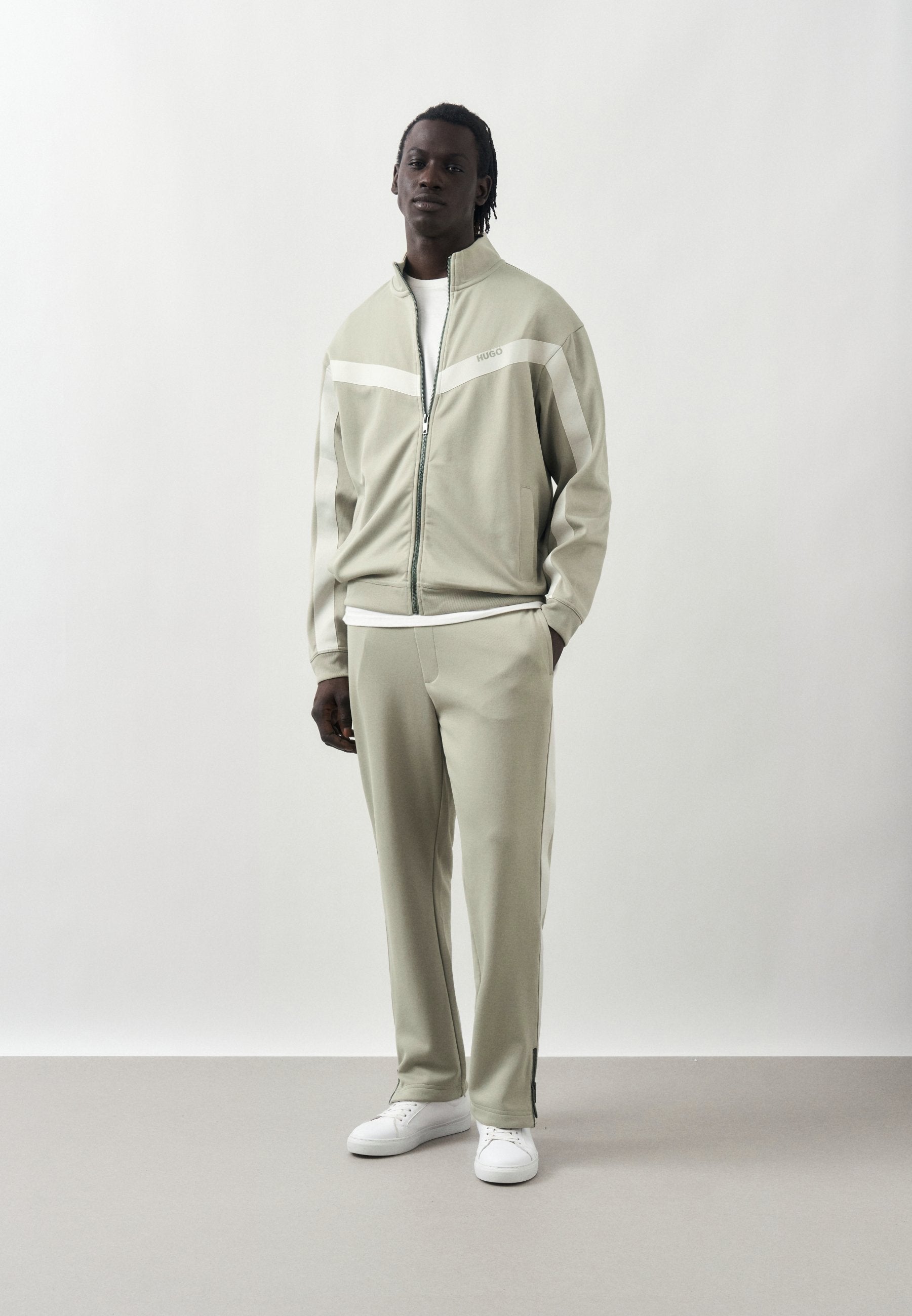 DOLOS - Tracksuit bottoms - pastel green