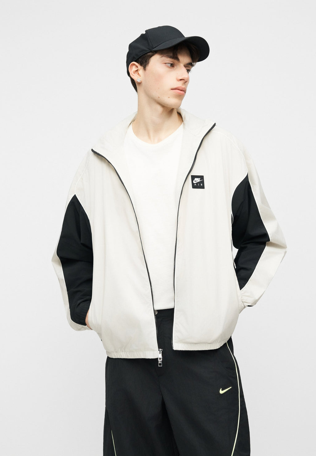 TOBI - Tracksuit bottoms - black/volt ice/cream
