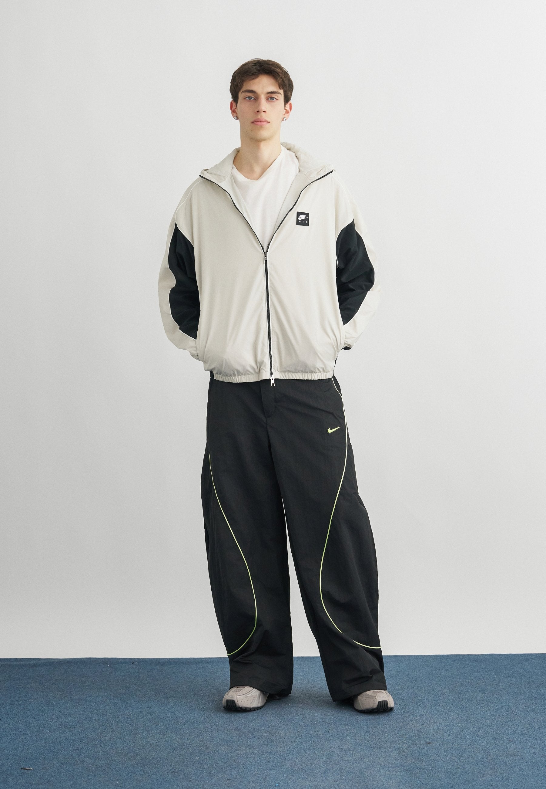 TOBI - Tracksuit bottoms - black/volt ice/cream