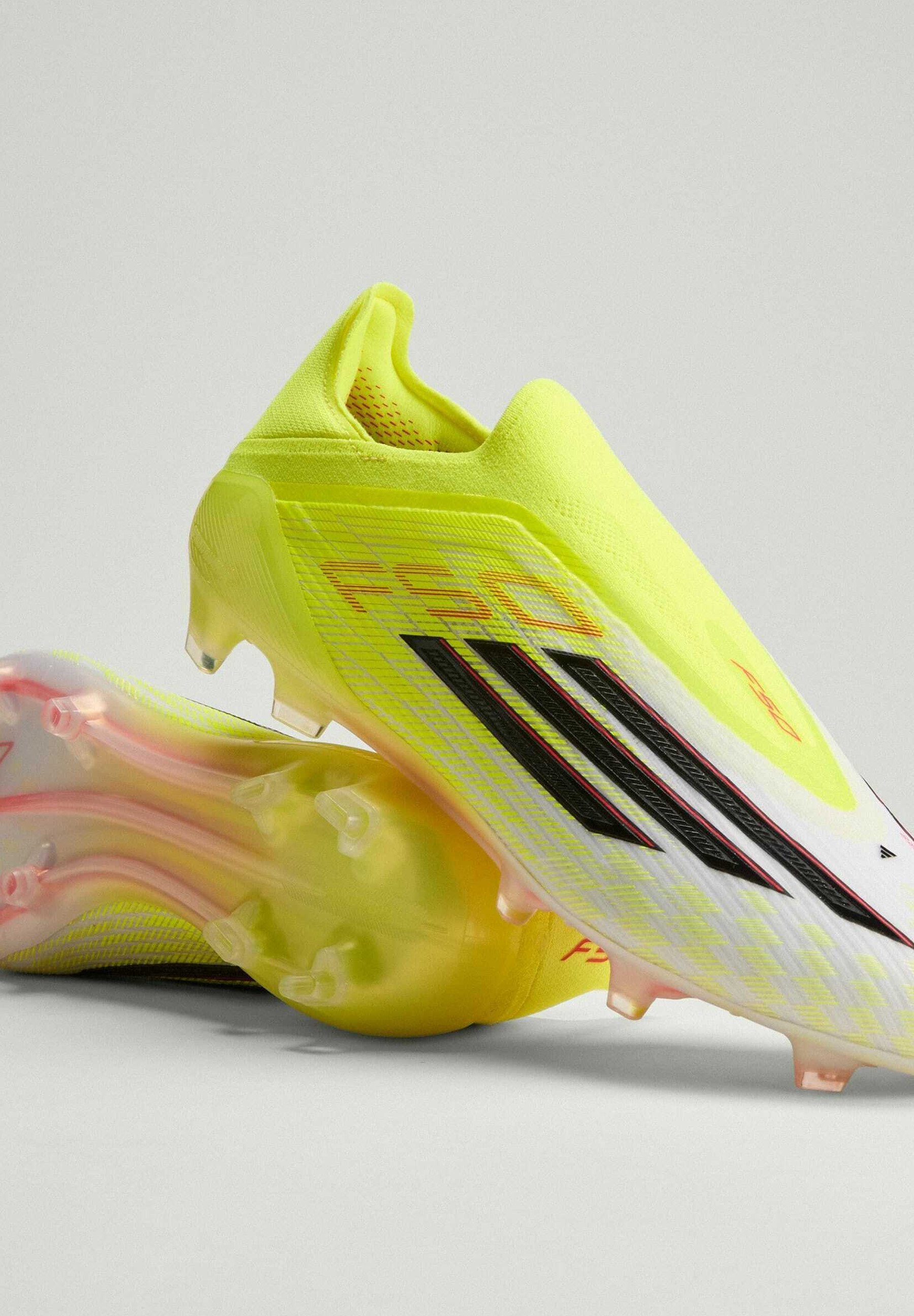 F50 ELITE LACELESS FG - Chaussures de football pour terrain sec - jaune solaire/noir/rouge vif