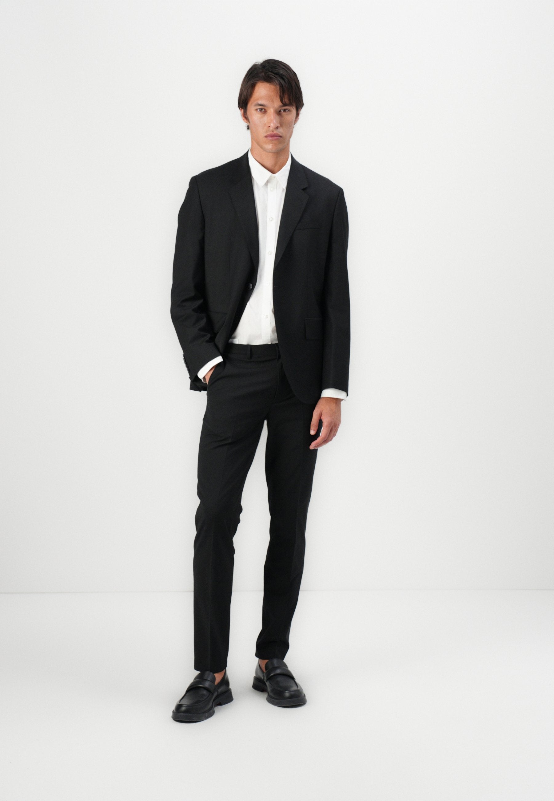 HESTEN - Trousers - black