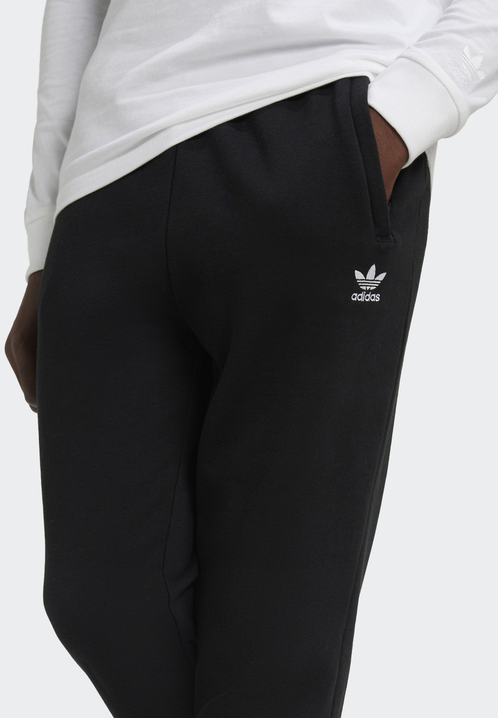 JUNIOR  - Tracksuit bottoms - black