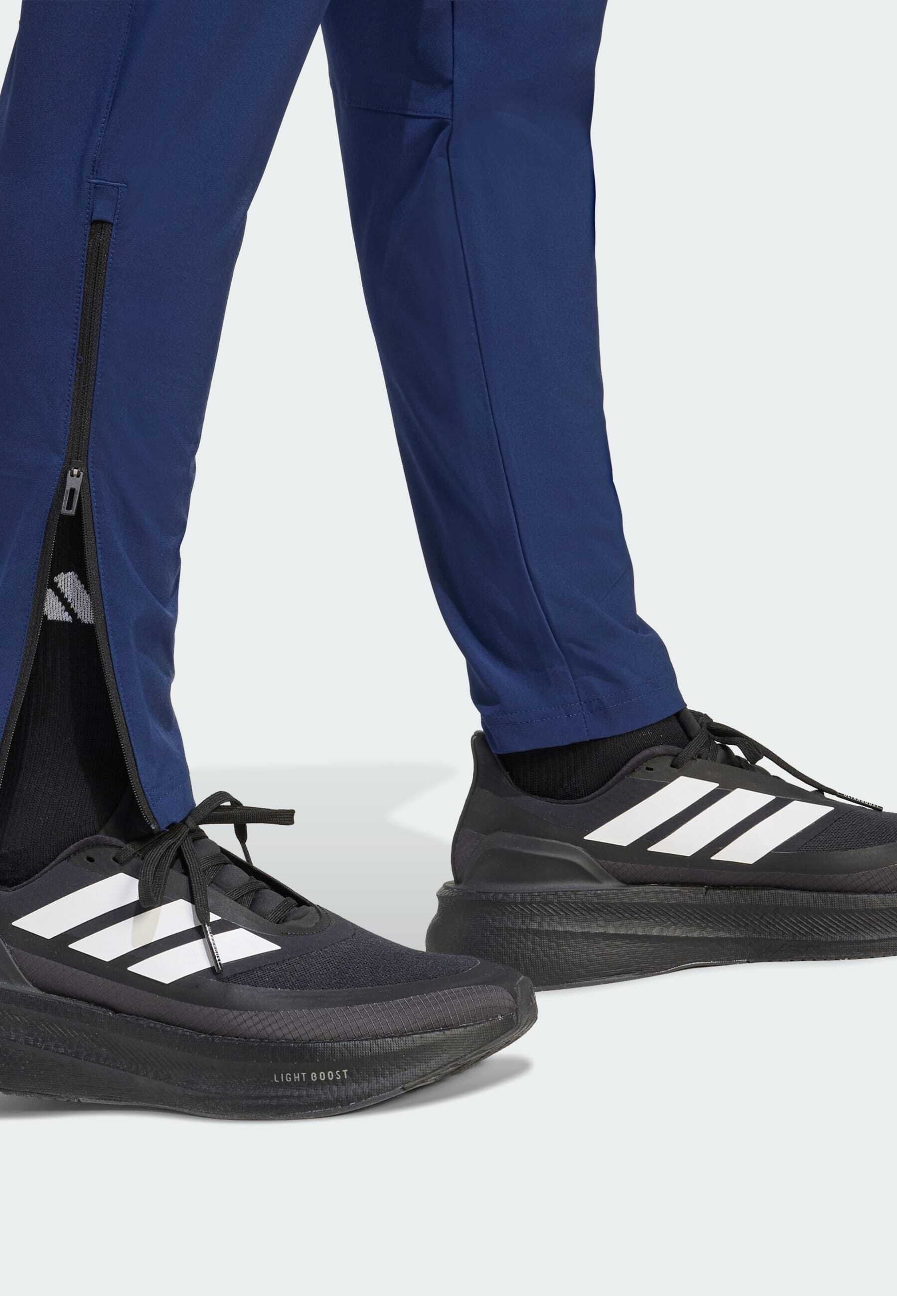 TIRO TRAVEL  - Tracksuit bottoms - team navy blue/black