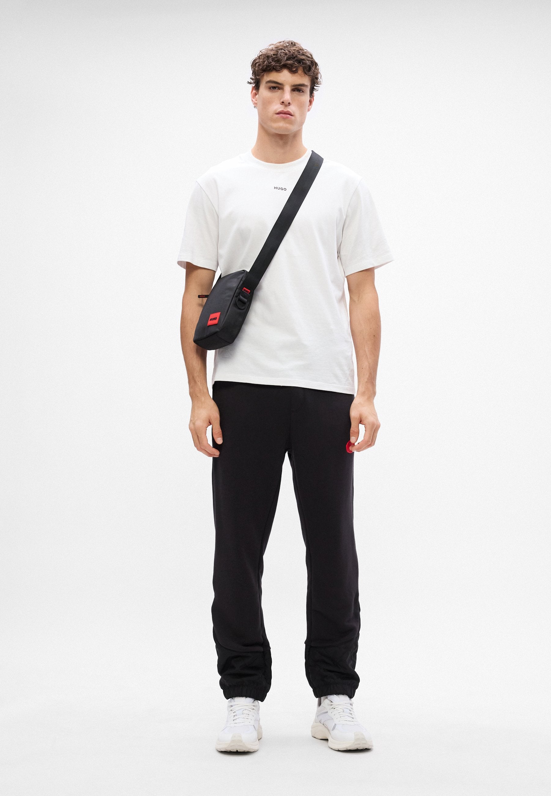 DILVANOS - Tracksuit bottoms - black