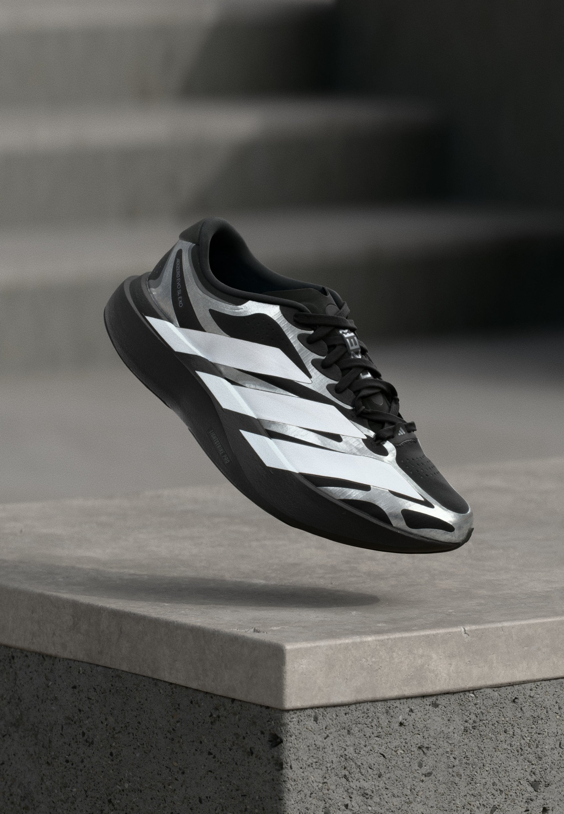 ADIZERO EVO SL EXO M - Trainers - core black/footwear white/iron metallic
