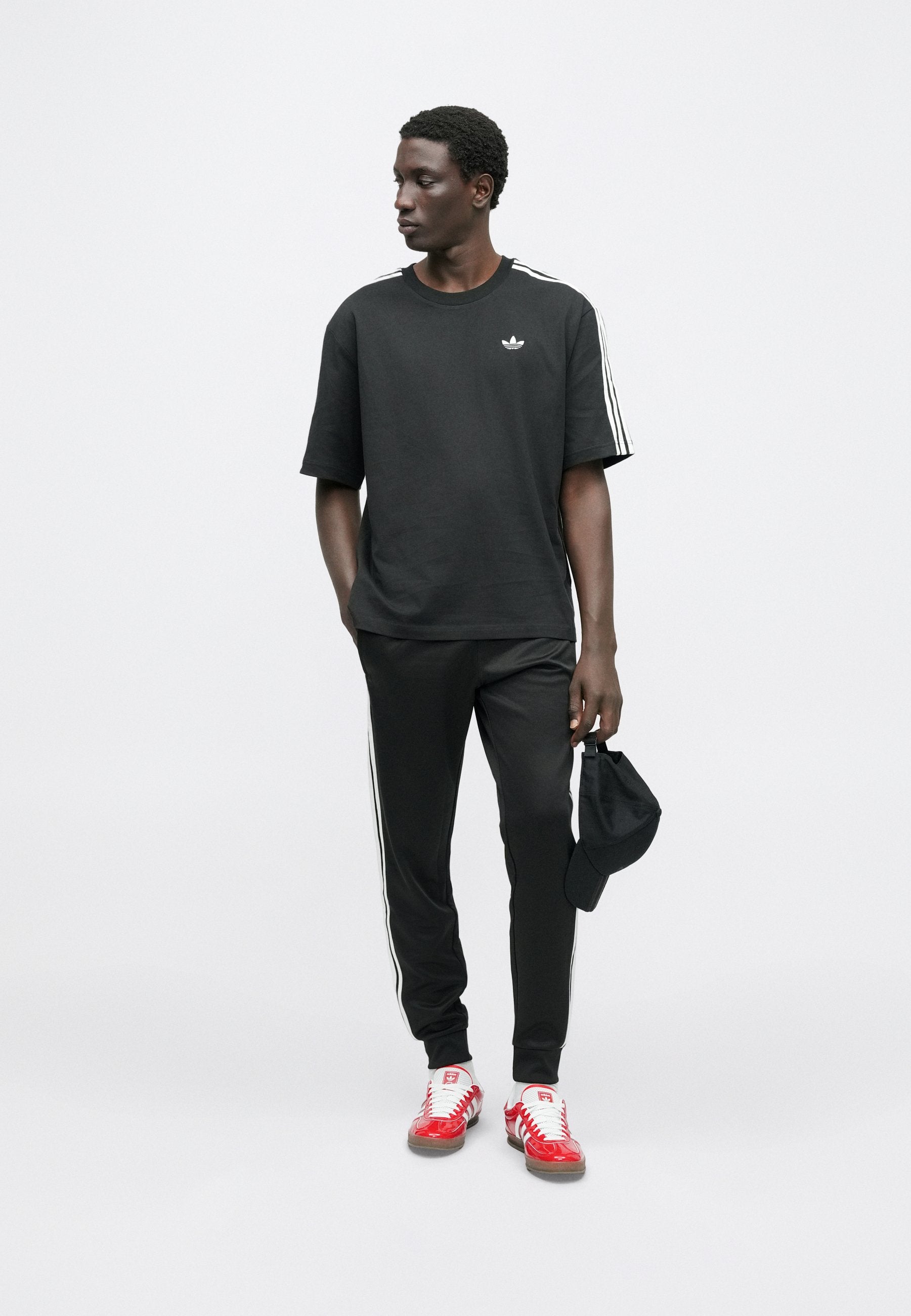 SST TP - Tracksuit bottoms - black