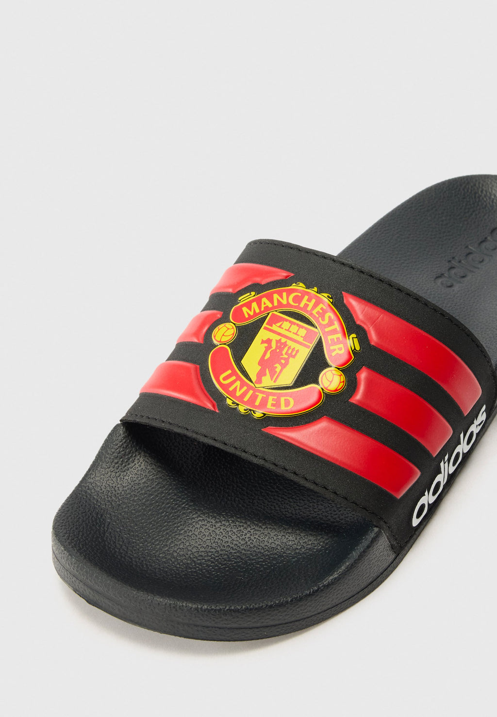 ADILETTE MANCHESTER UNITED UNISEX - نعال حمام - أسود أساسي/أحمر/أبيض