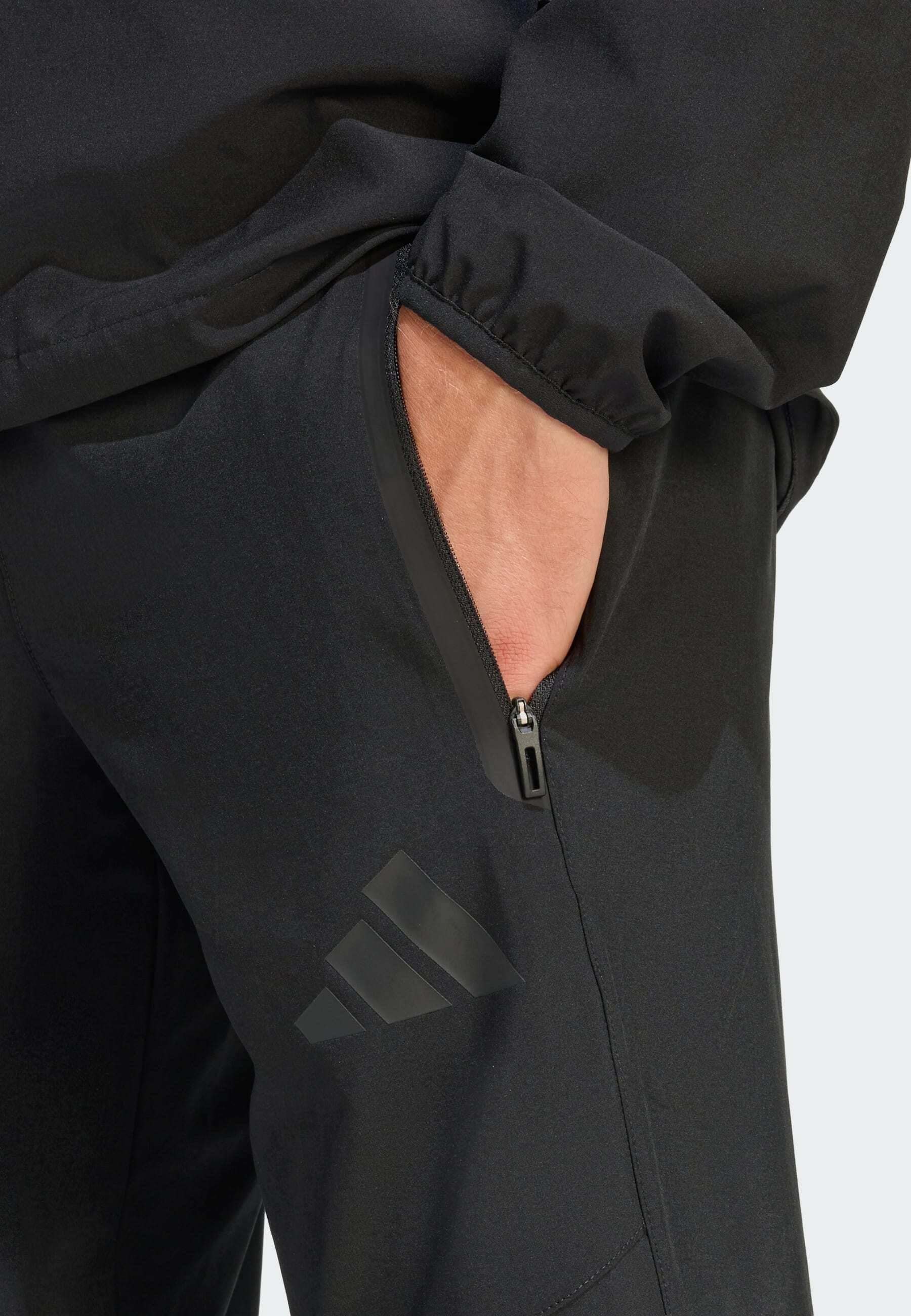 TIRO TRAVEL  - Tracksuit bottoms - black   black