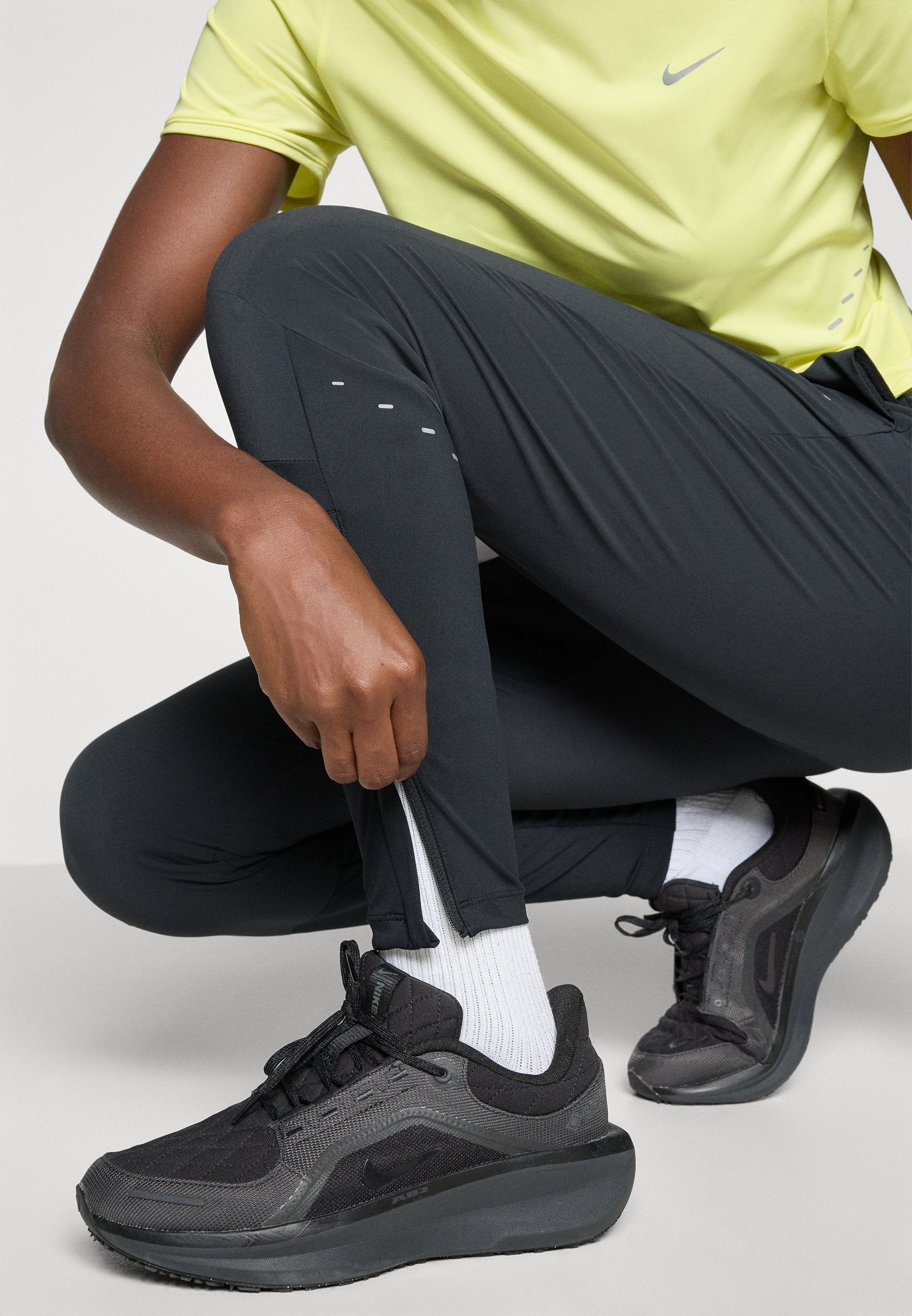 SWIFT - Tracksuit bottoms - black/reflective silver-coloured