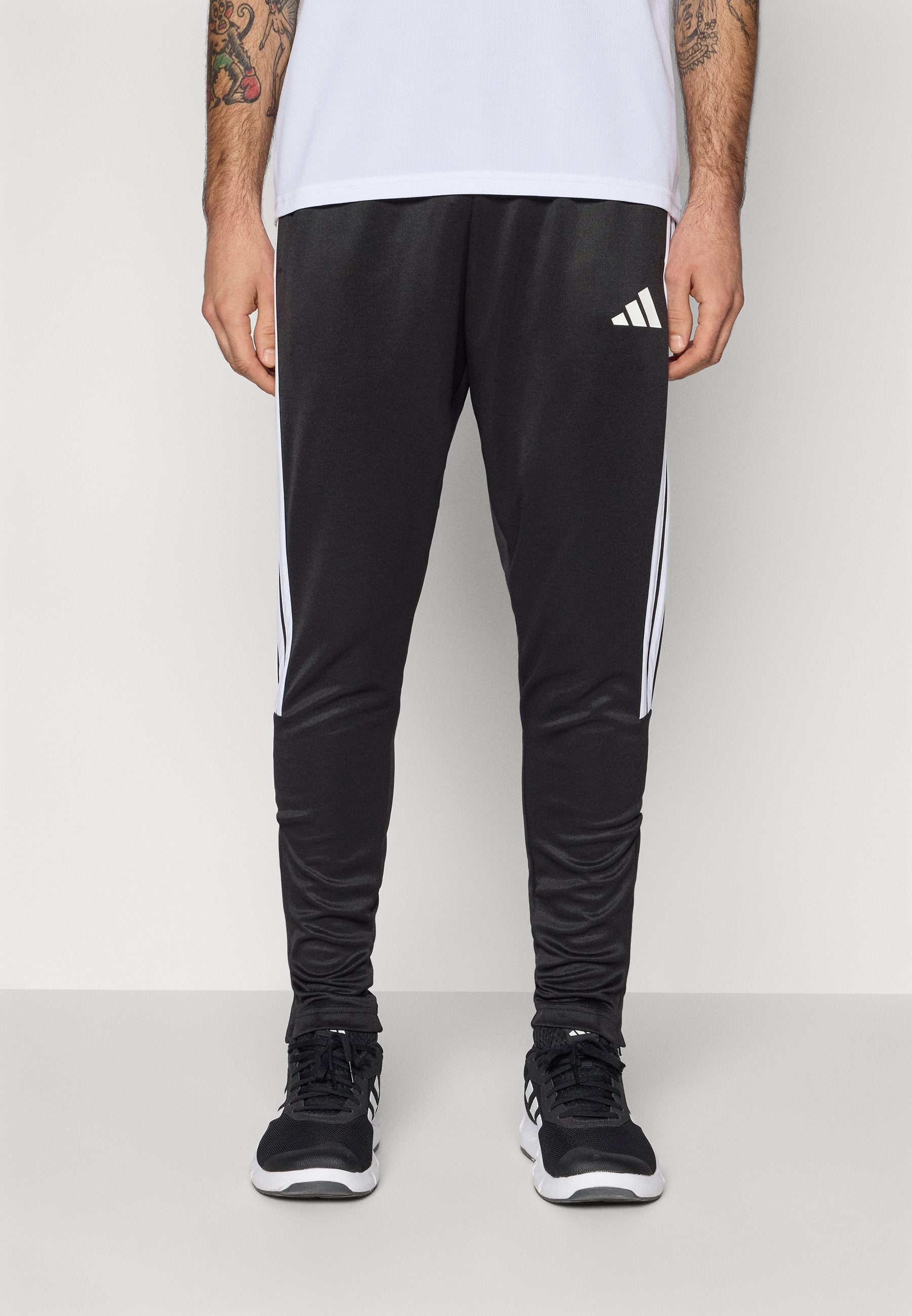 TIRO - Tracksuit bottoms - black/white