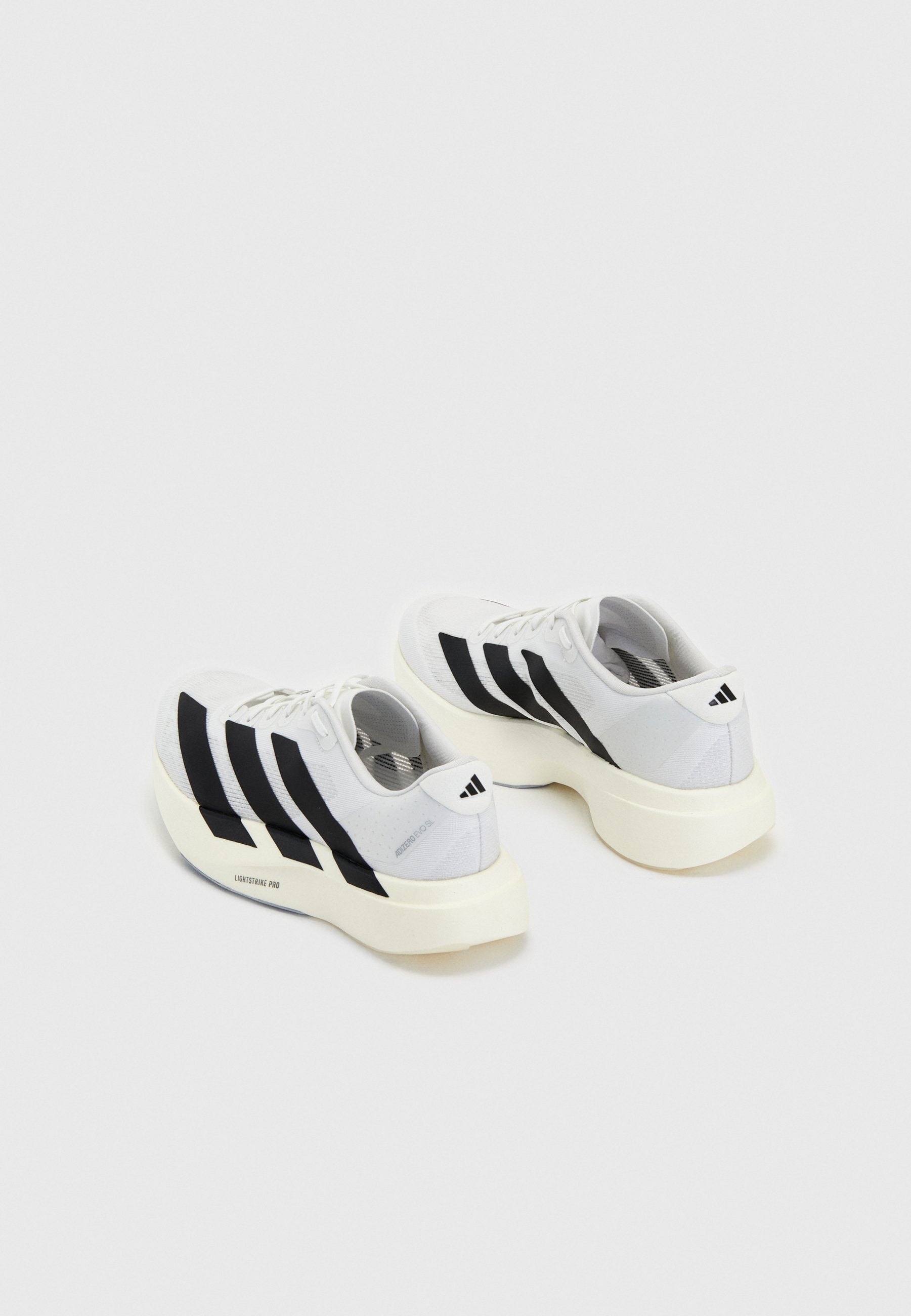 ADIZERO EVO SL W - Trainers - white/core black