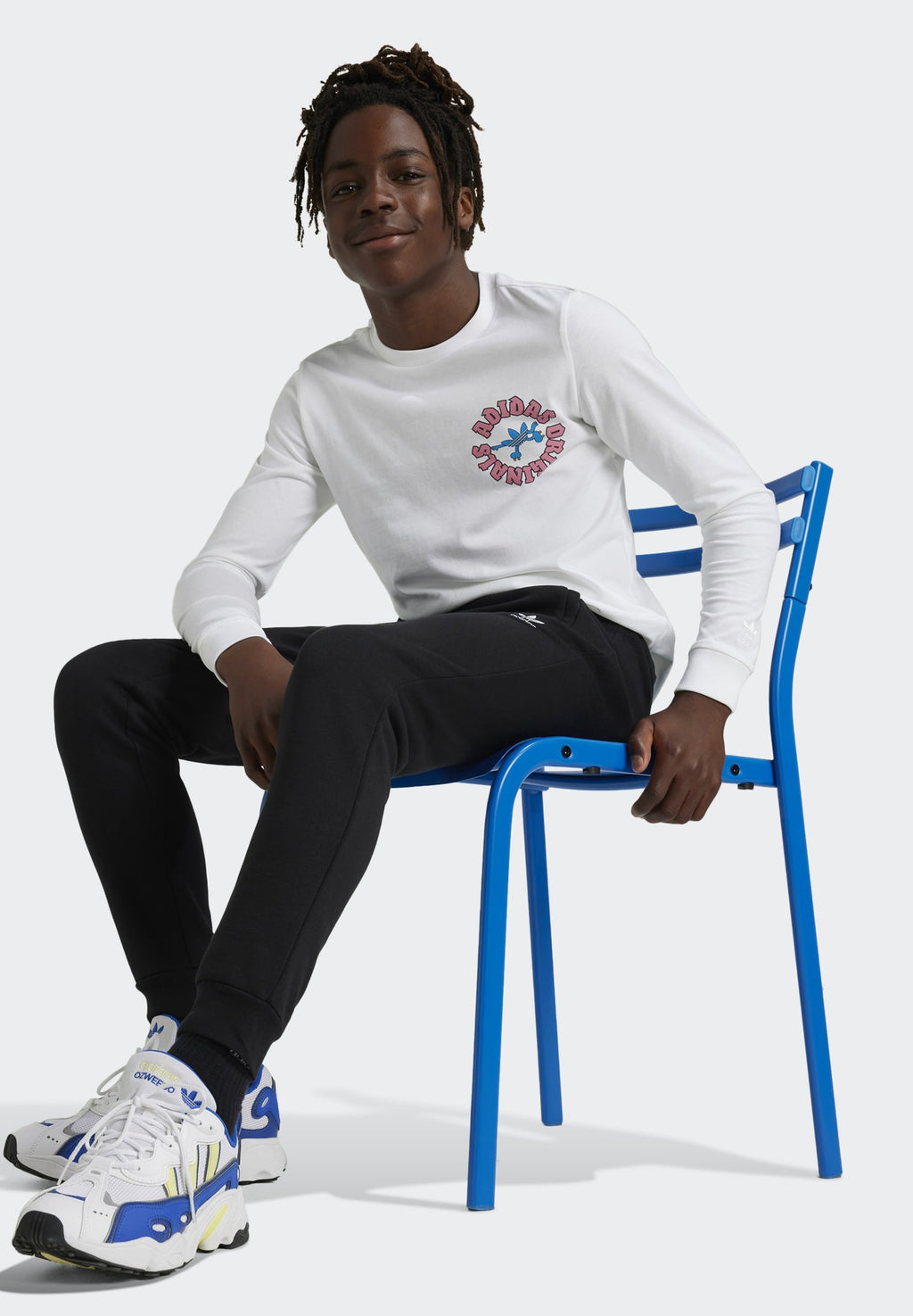 JUNIOR  - Tracksuit bottoms - black
