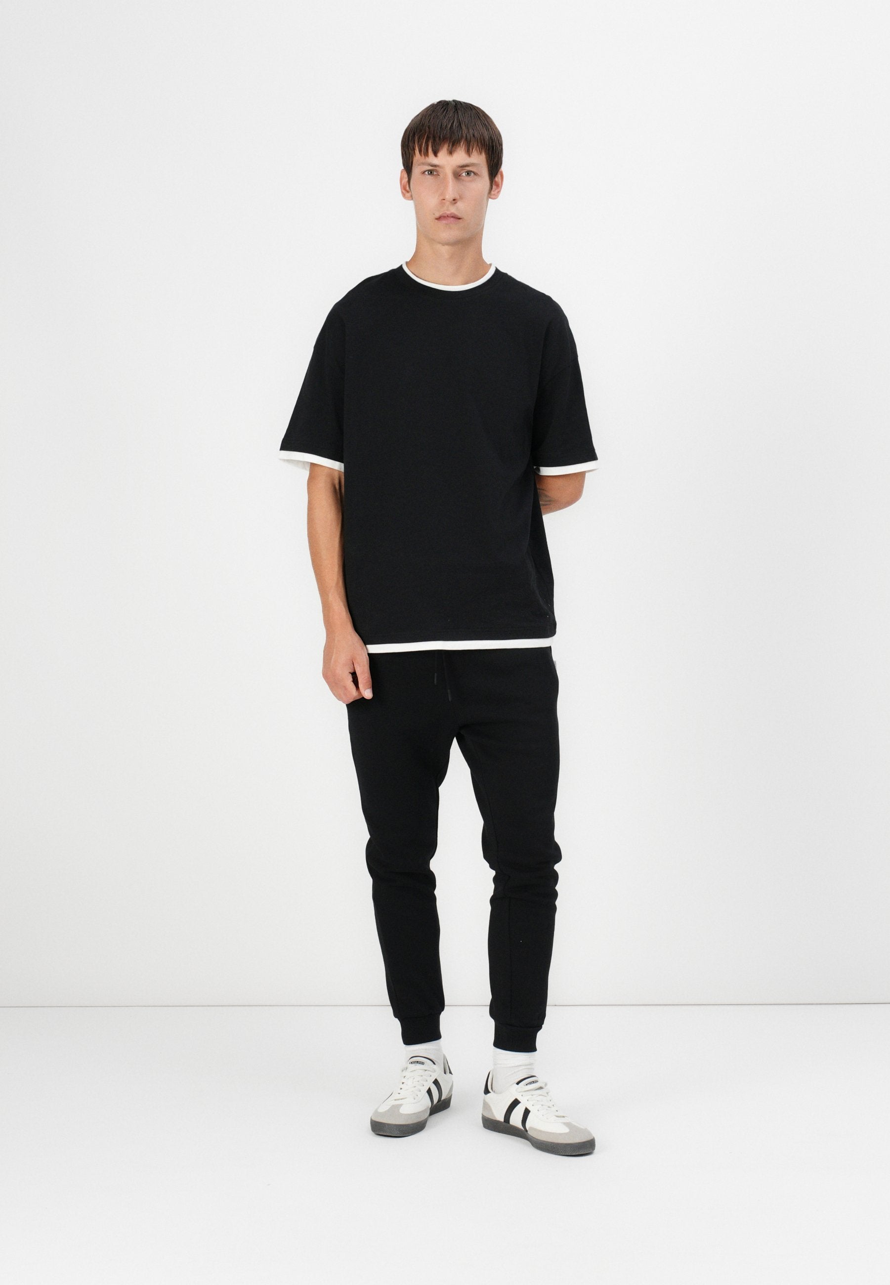 Regular Fit - Tracksuit bottoms - black