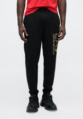 TRAIN CORE BIG LOGO PANTS - Tracksuit bottoms - black/gold-coloured