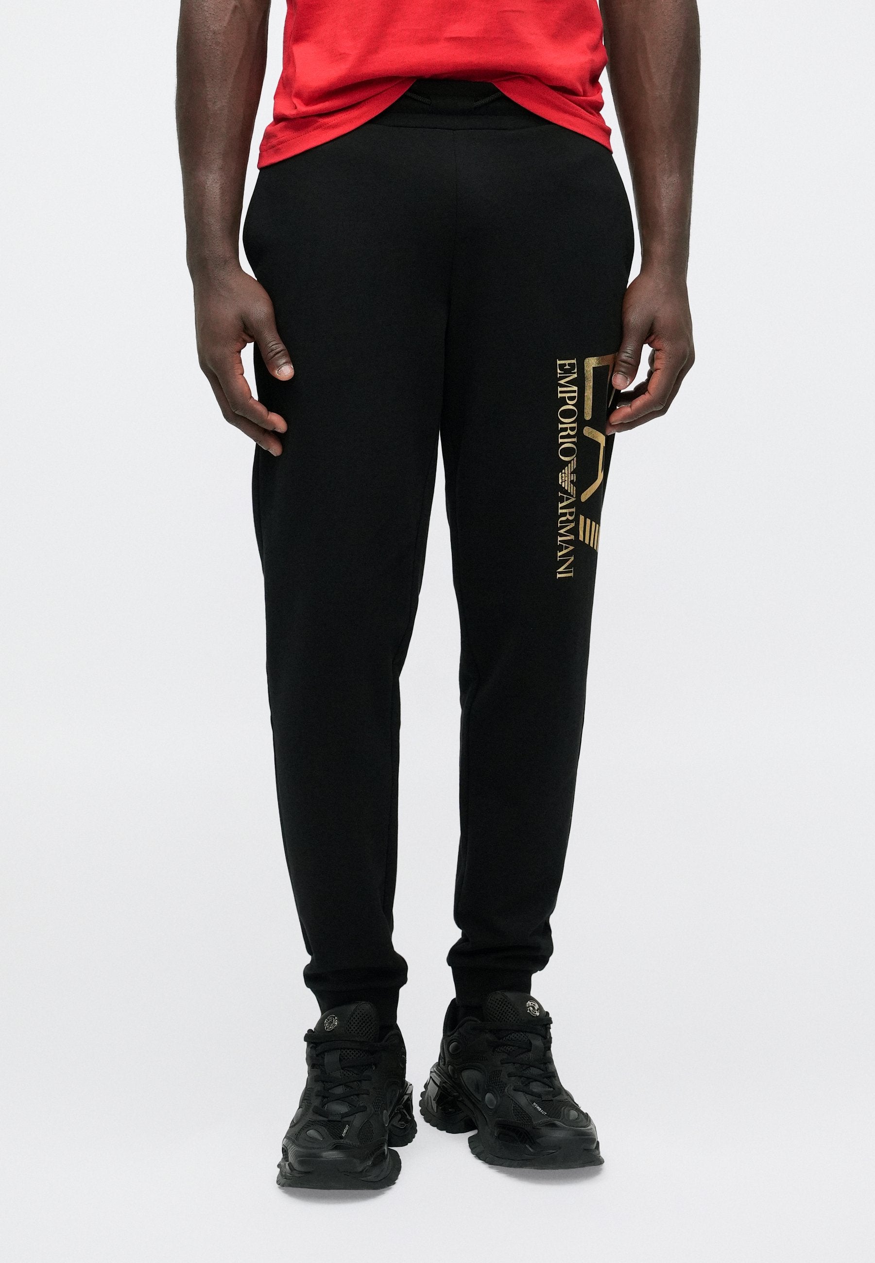 TRAIN CORE BIG LOGO PANTS - Tracksuit bottoms - black/gold-coloured