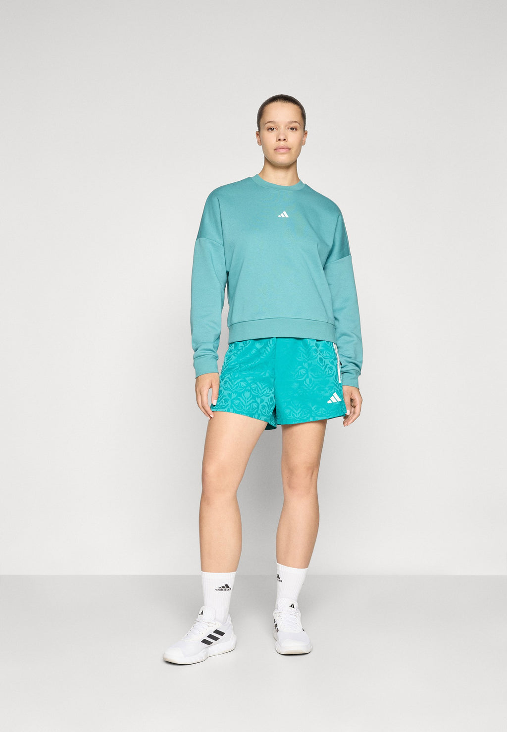 TIRO  - Sports shorts - pure teal/white
