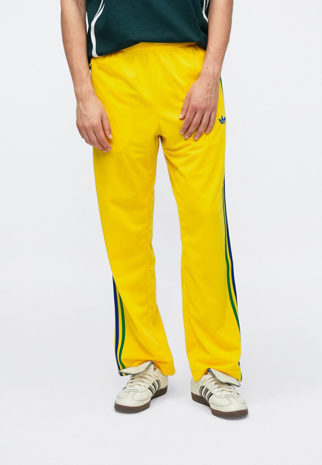 FIREBIRD TP - Tracksuit bottoms - yellow
