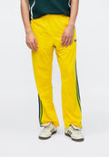 FIREBIRD TP - Tracksuit bottoms - yellow
