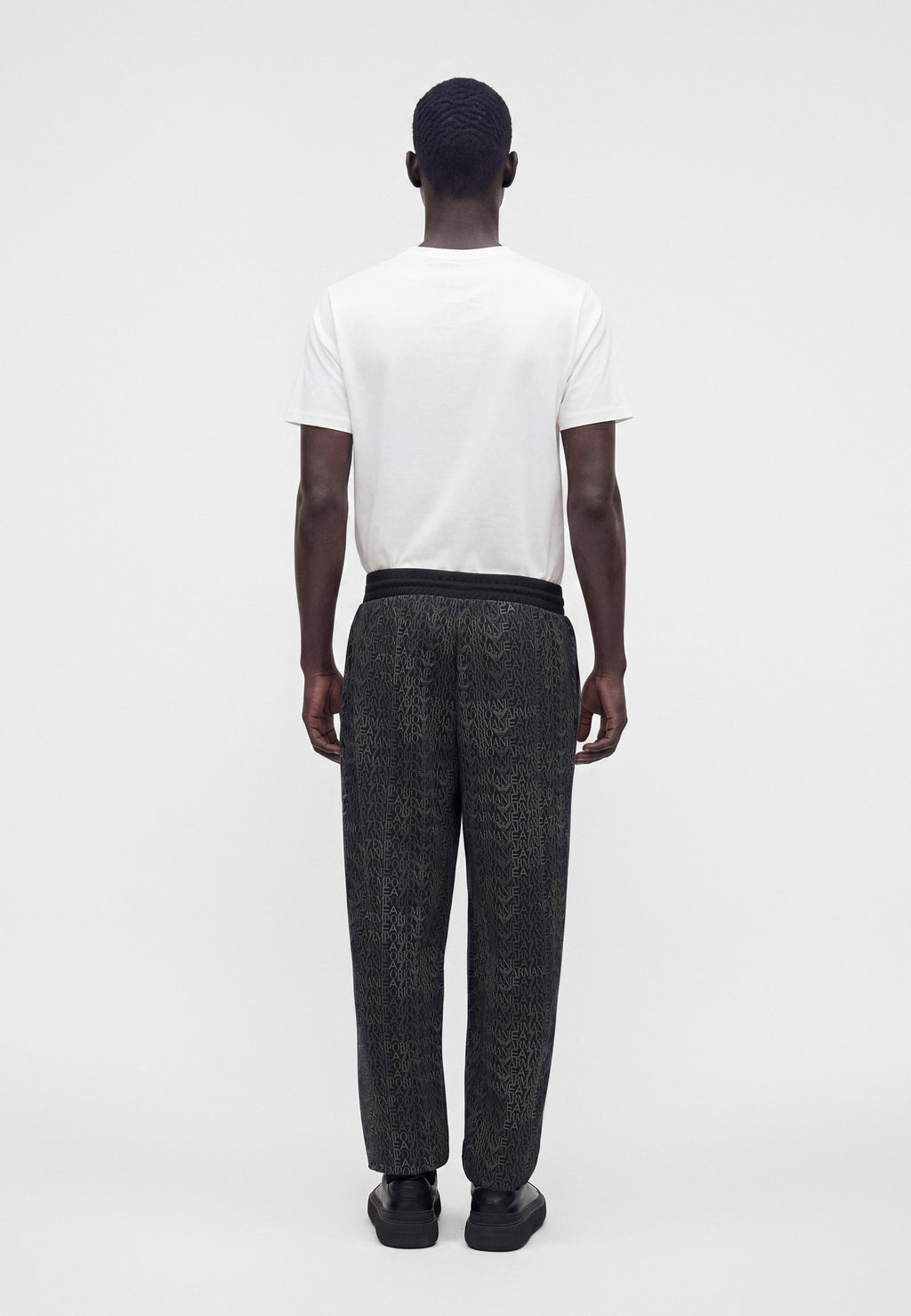 TRAIN LOGO SERIES MONOGRAM - Tracksuit bottoms - black