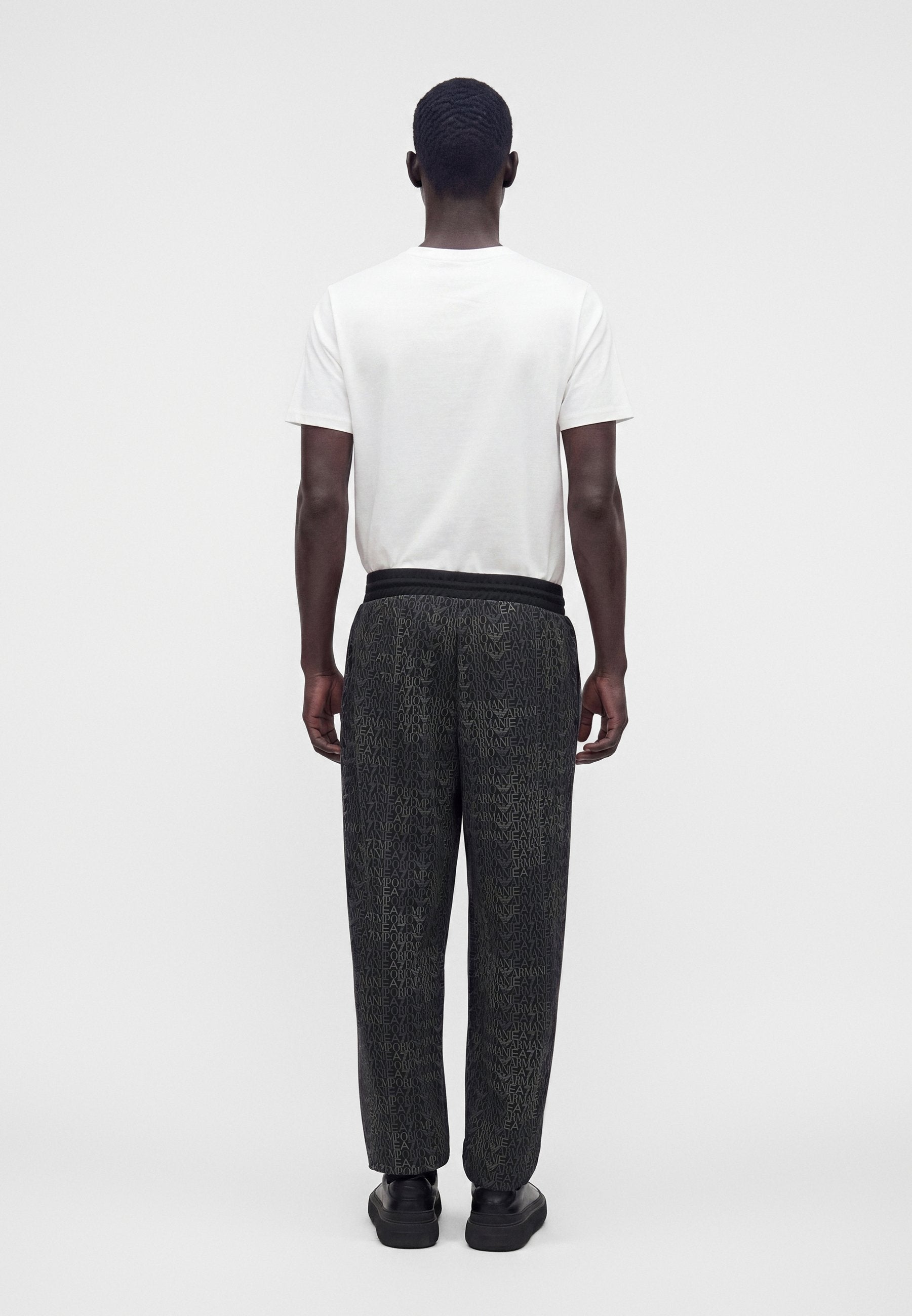 TRAIN LOGO SERIES MONOGRAM - Tracksuit bottoms - black