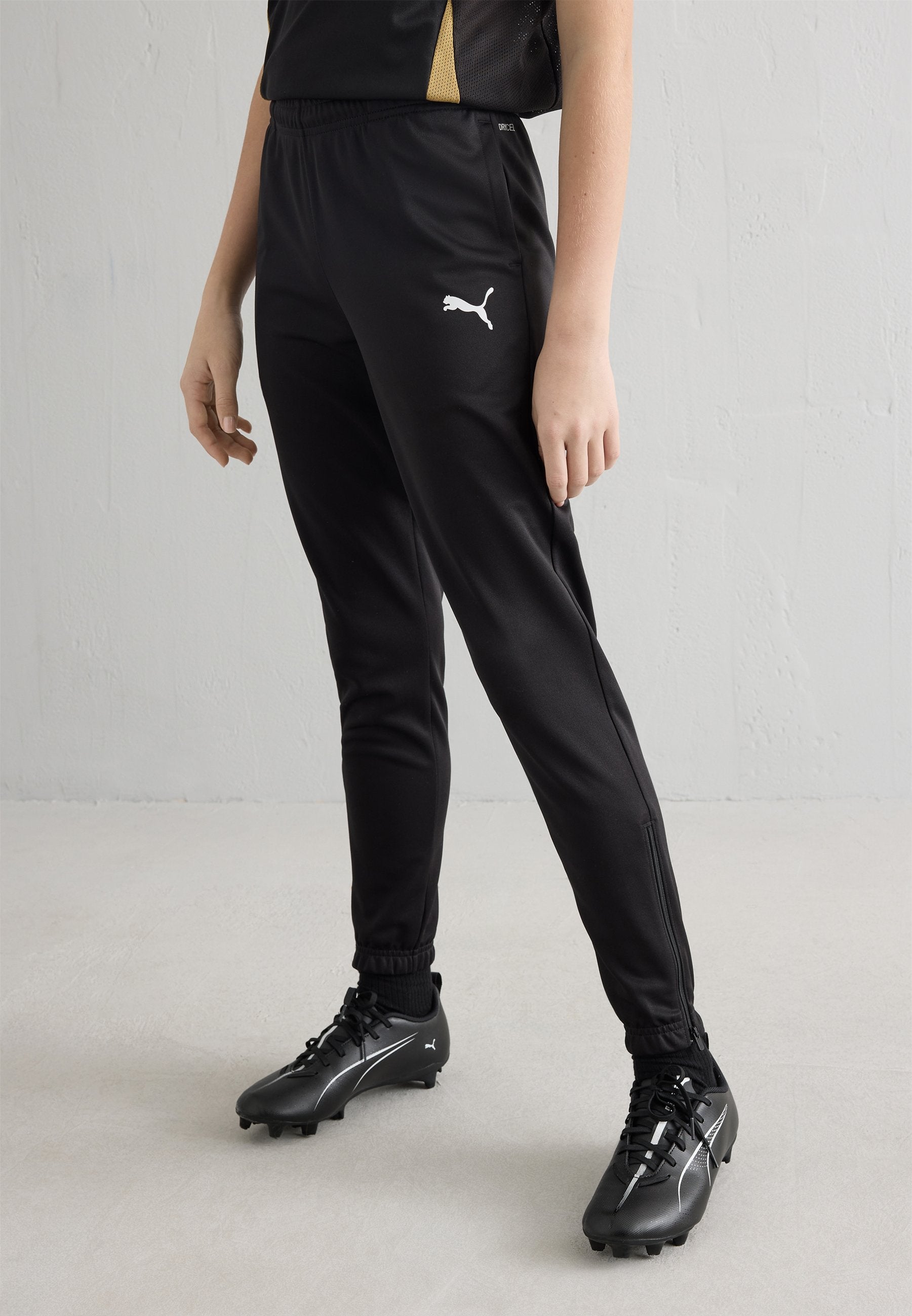 TEAMRISE POLY TRAINING UNISEX - Tracksuit bottoms - black/white
