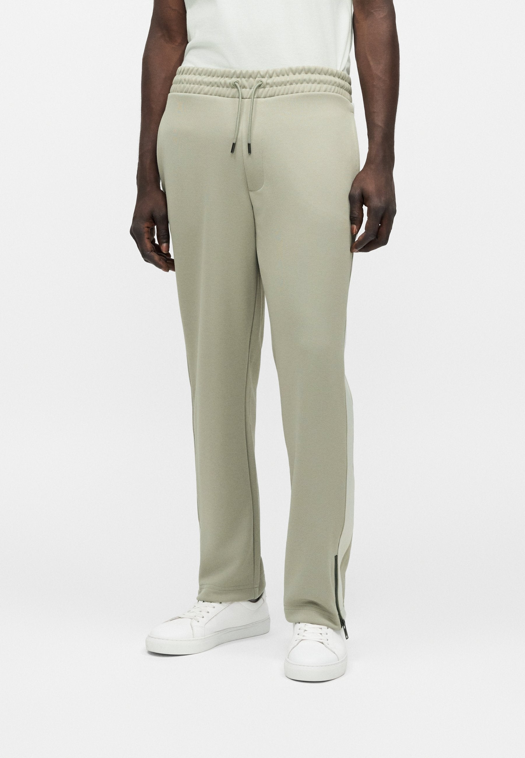 DOLOS - Tracksuit bottoms - pastel green