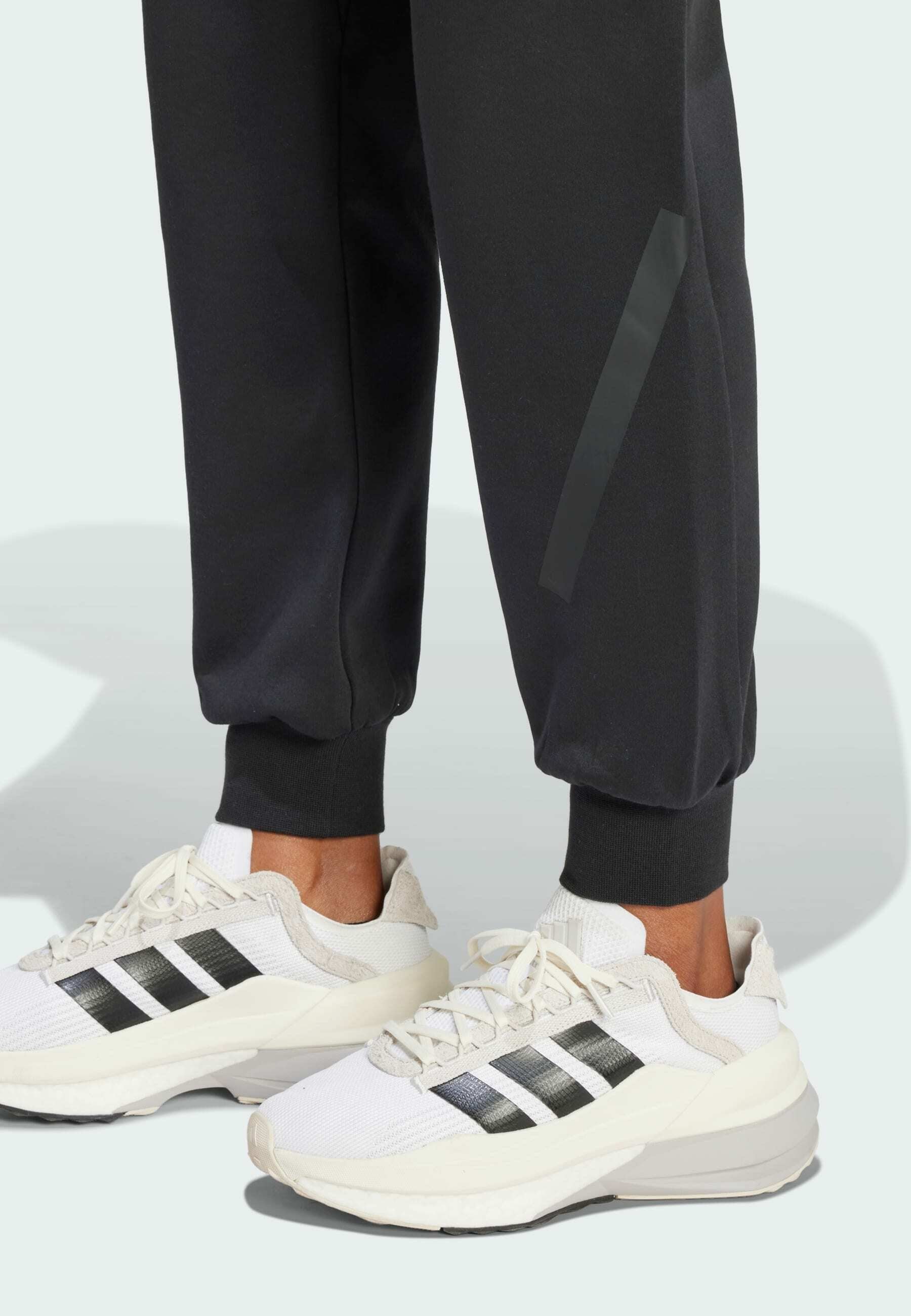 ADIDAS Z.N.E. - Tracksuit bottoms - black