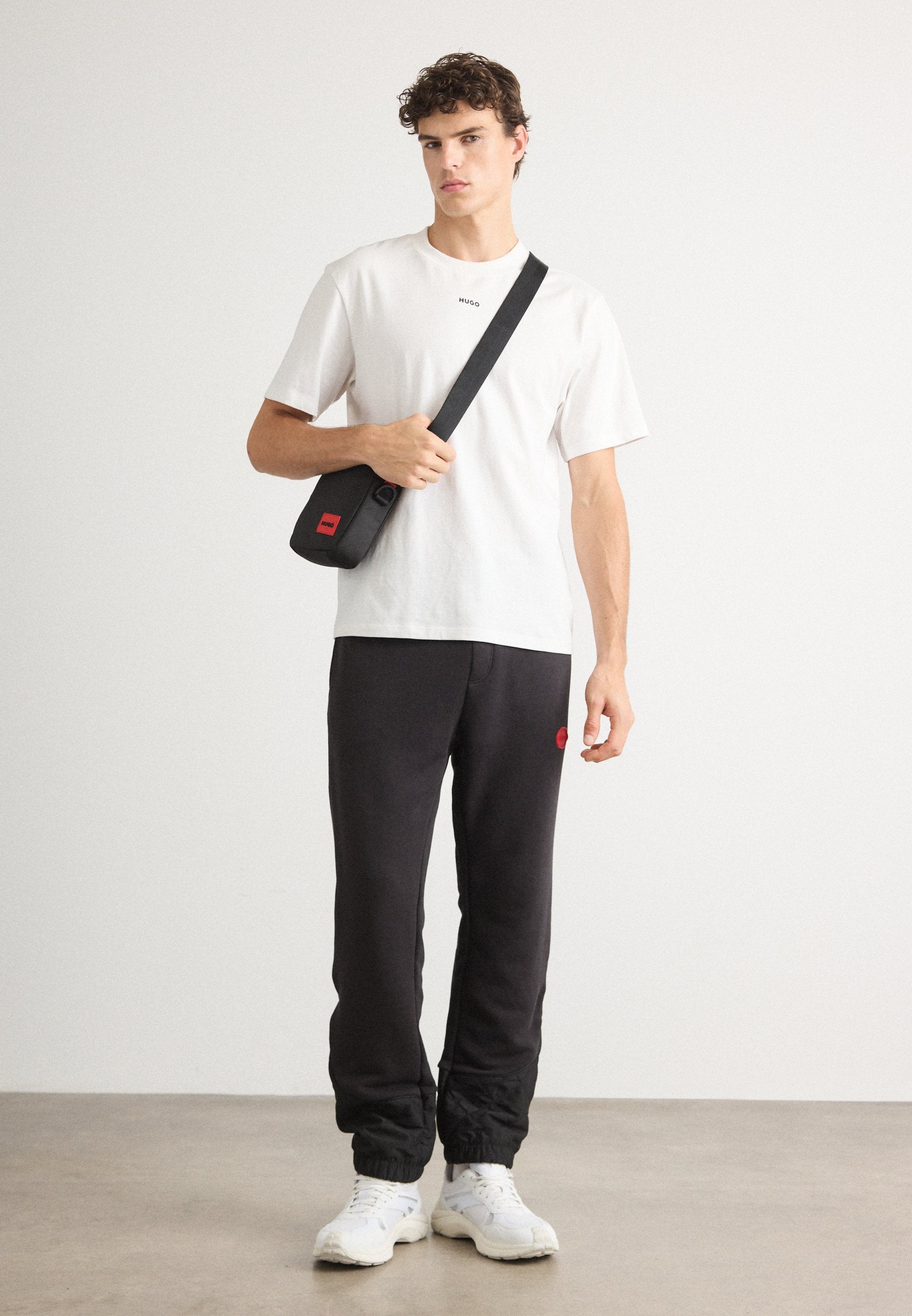 DILVANOS - Tracksuit bottoms - black