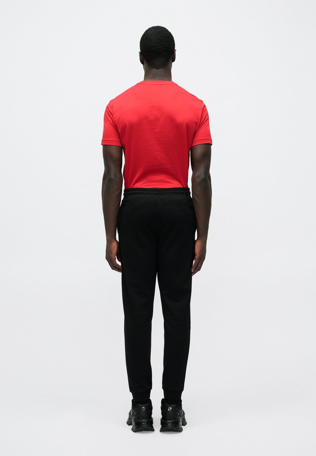 TRAIN CORE BIG LOGO PANTS - Tracksuit bottoms - black/gold-coloured