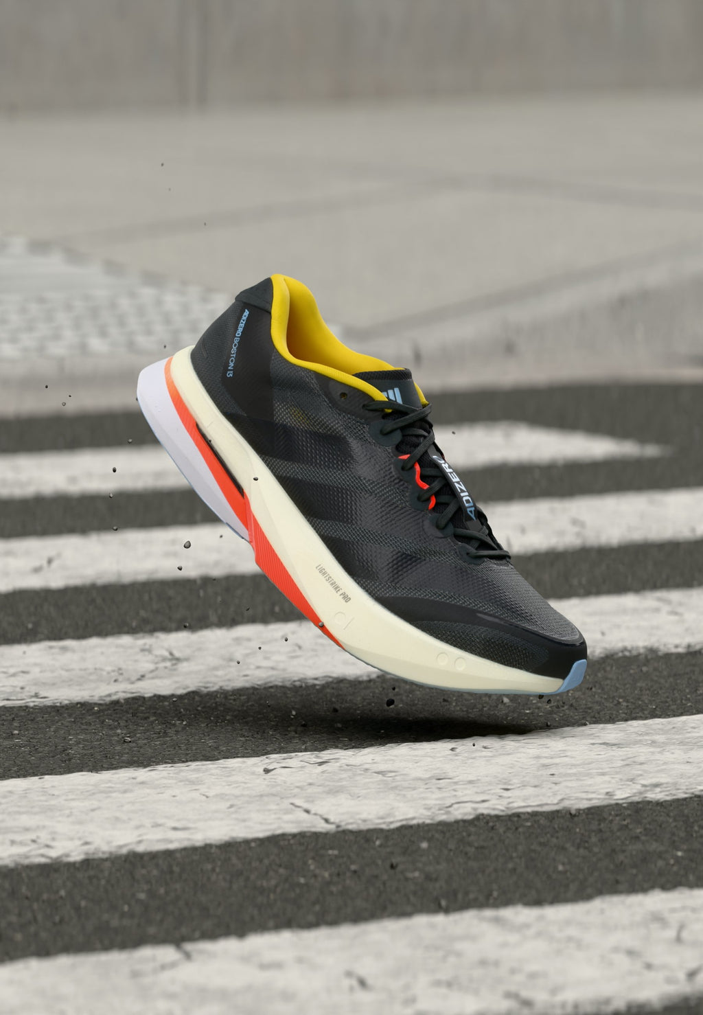 ADIZERO BOSTON 13 M - Road running shoes - carbon/core black/impact orange