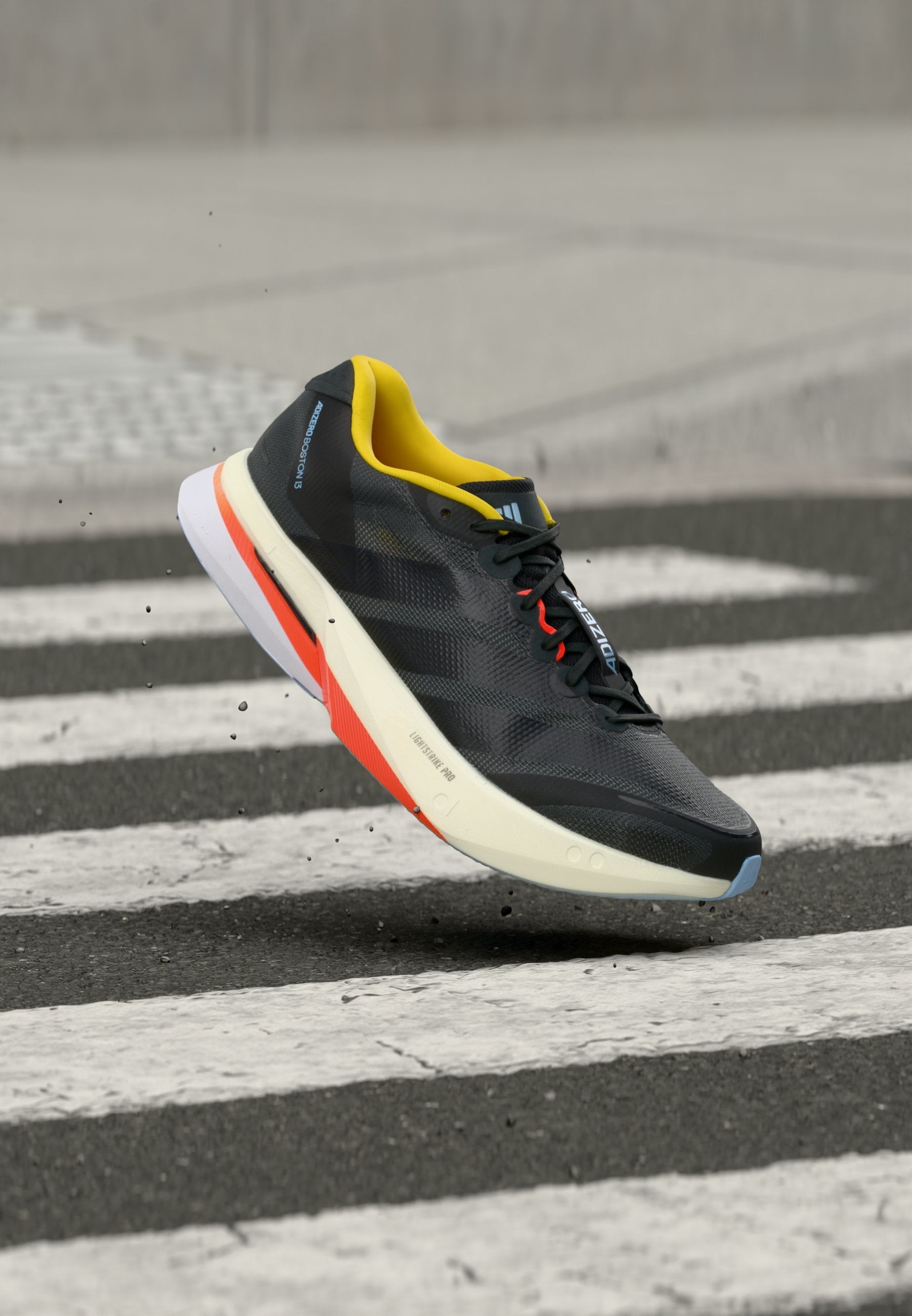 ADIZERO BOSTON 13 M - Road running shoes - carbon/core black/impact orange